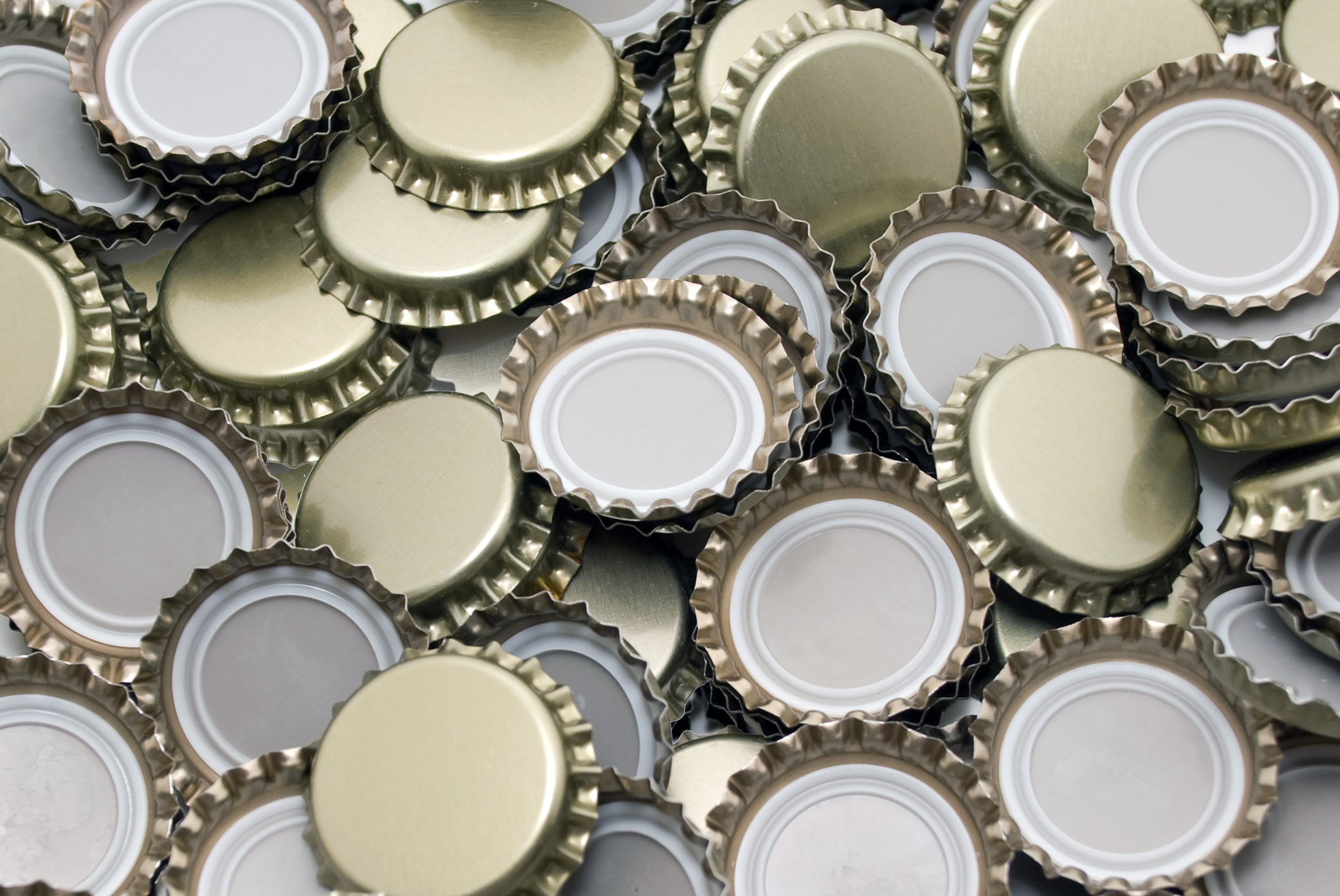 Beer bottle caps in a pile.