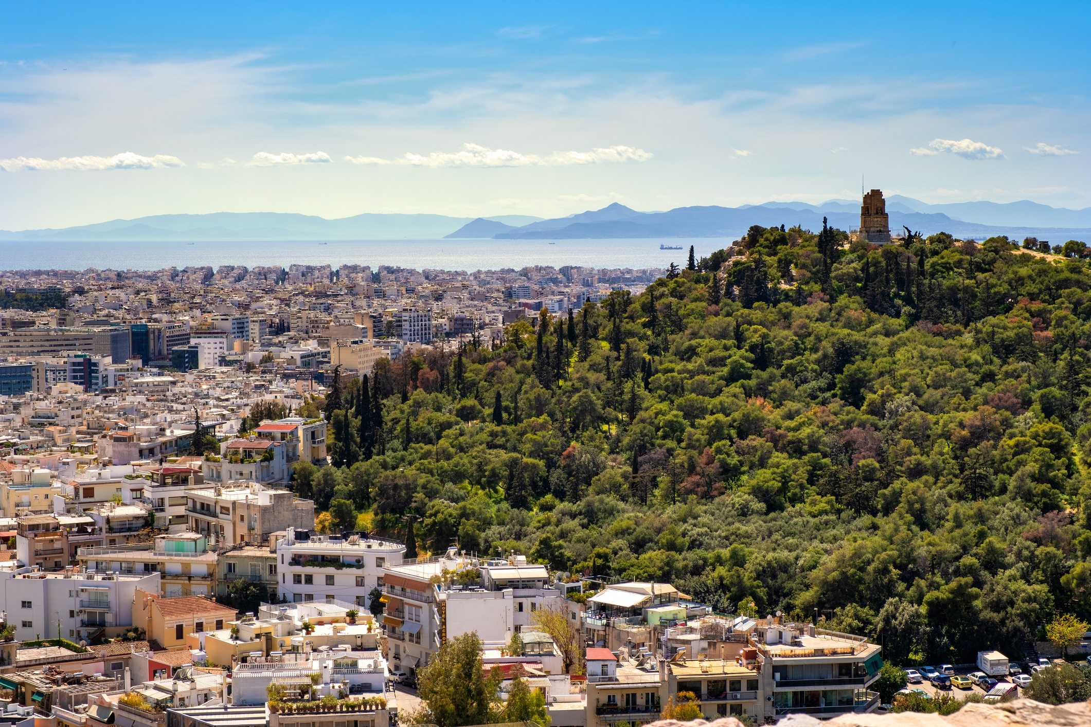 Panoramic view of metropolitan Athens, Greece with Philopappos Monument and Philopappou Hill - Mouseion Hill - seen from Acropolis hill