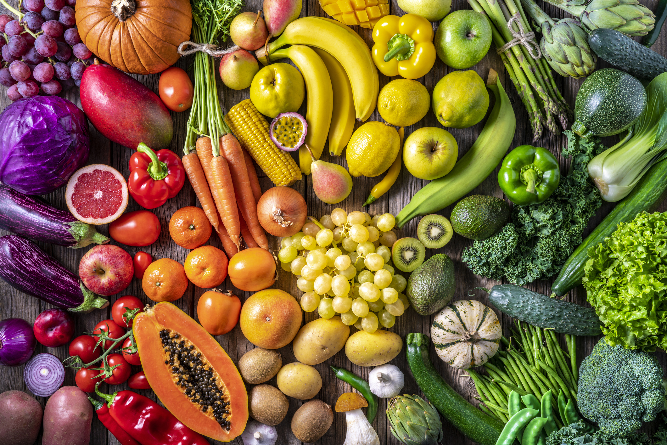 Colorful vegetables and fruits vegan food in rainbow colors arrangement full frame