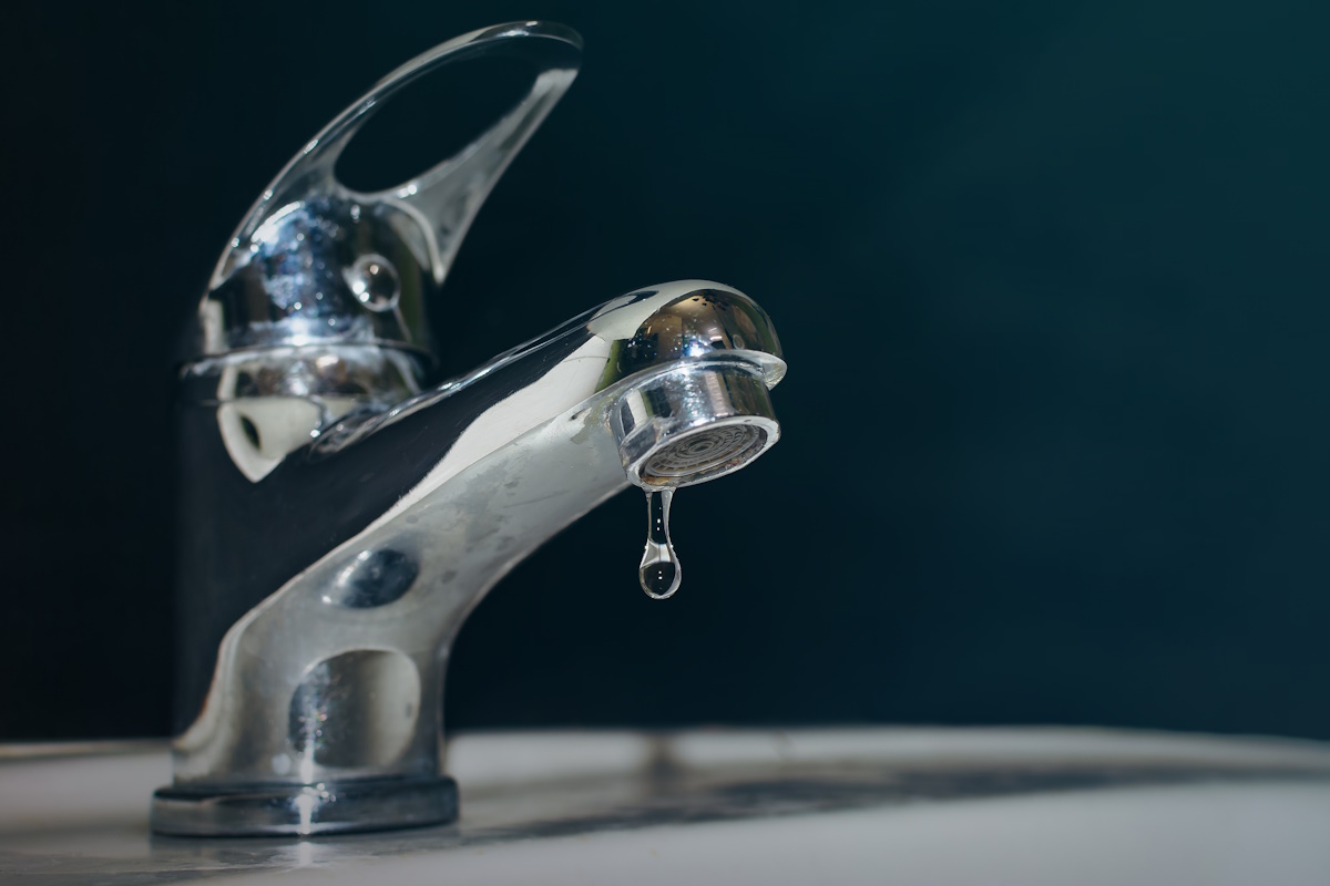 Close-up of the dripping tap