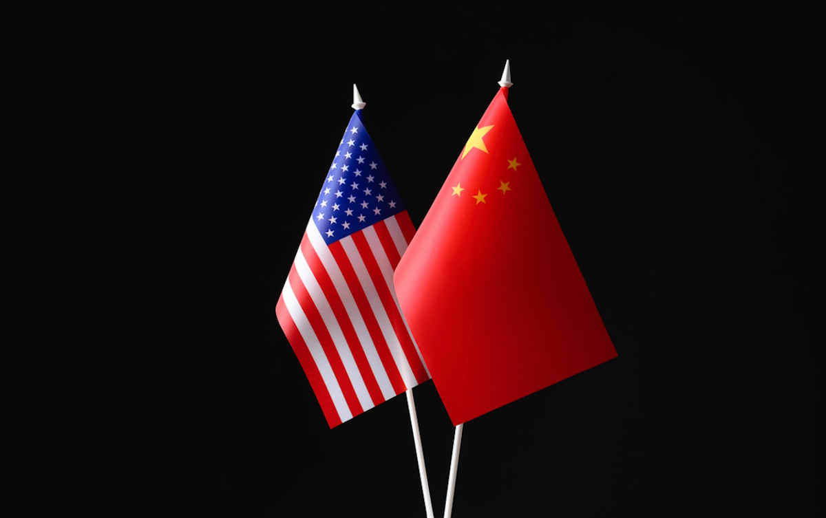 USA and China flags against black background. International relations