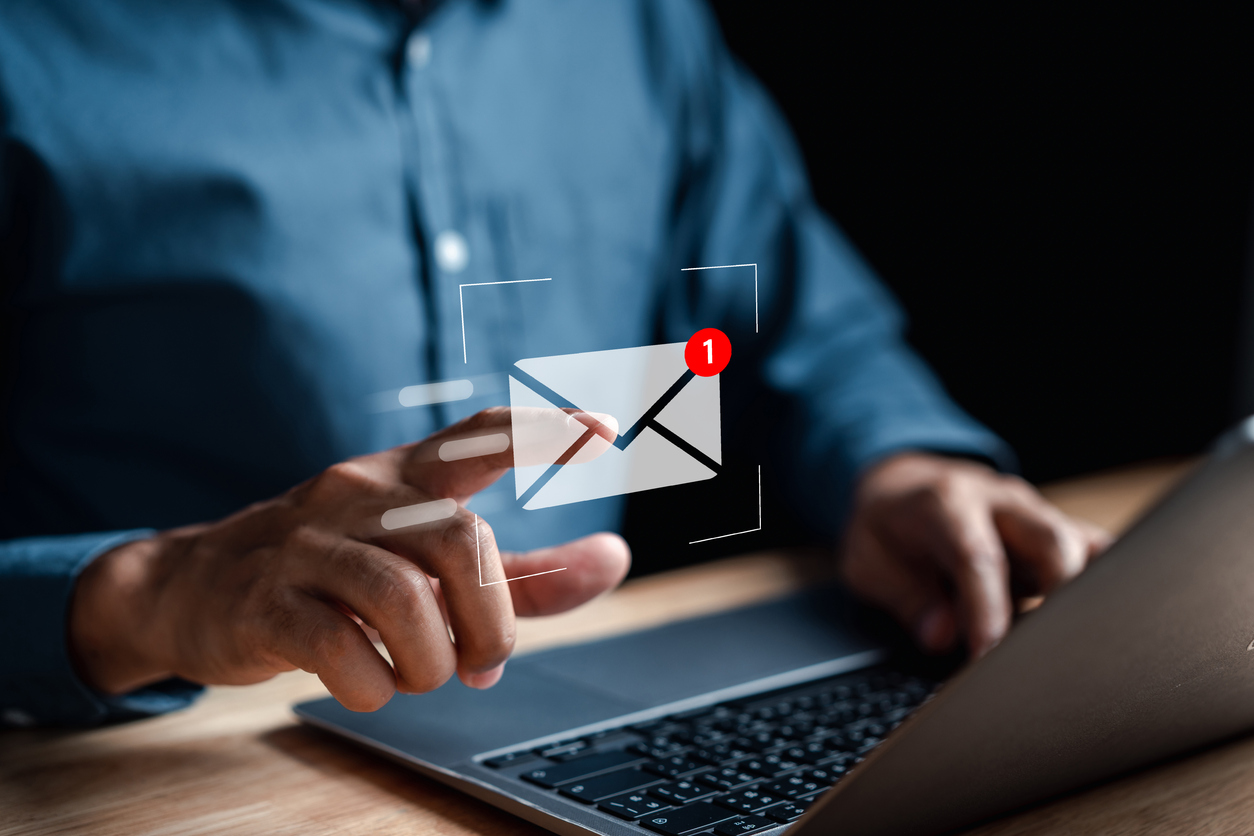 Businessman sending email by laptop computer to customer, business contact and communication, email icon, email marketing concept, send e-mail or newsletter, online working internet network.