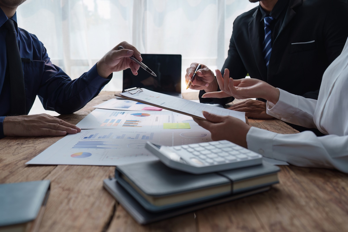 Fund managers team consultation and discuss about analysis Investment stock market. analysis, research finance.