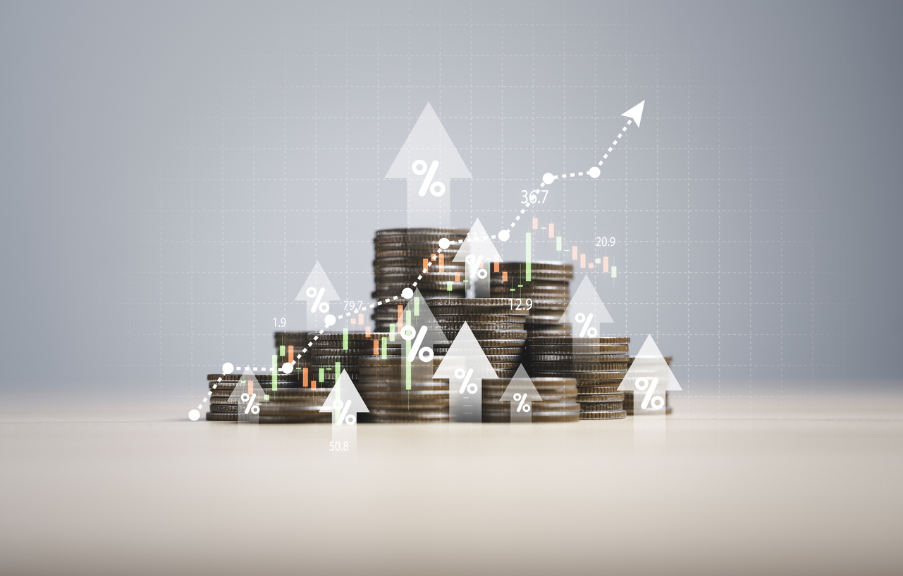 Heap of coins money with up arrow and stock market chart for financial banking increase interest rate or mortgage investment dividend from business growth concept.