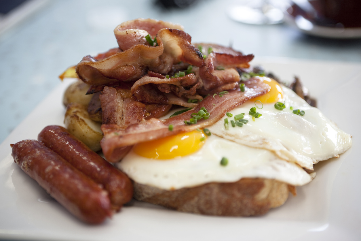 A delicious plate of traditional bacon, fried eggs, sausages and potato rosti on thick sourdough toast. More Food and Drink.