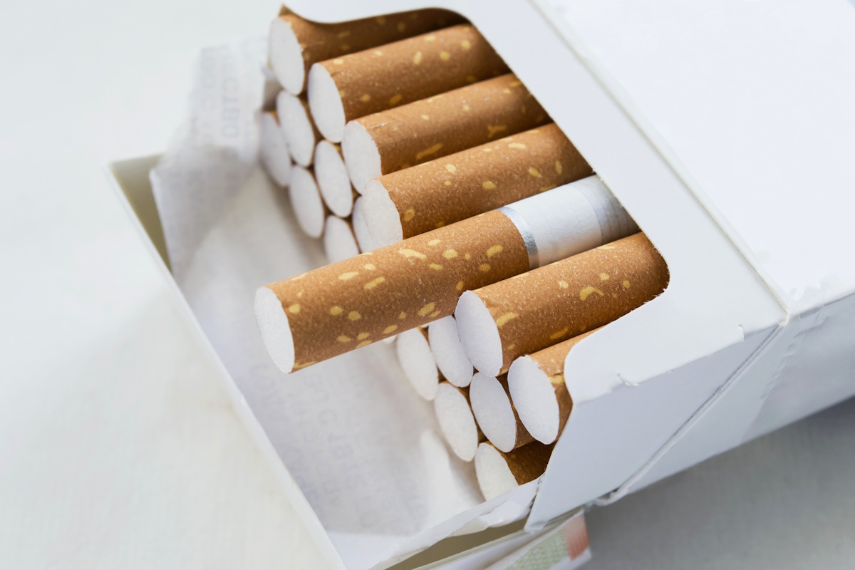 Opened pack full of cigarettes closeup