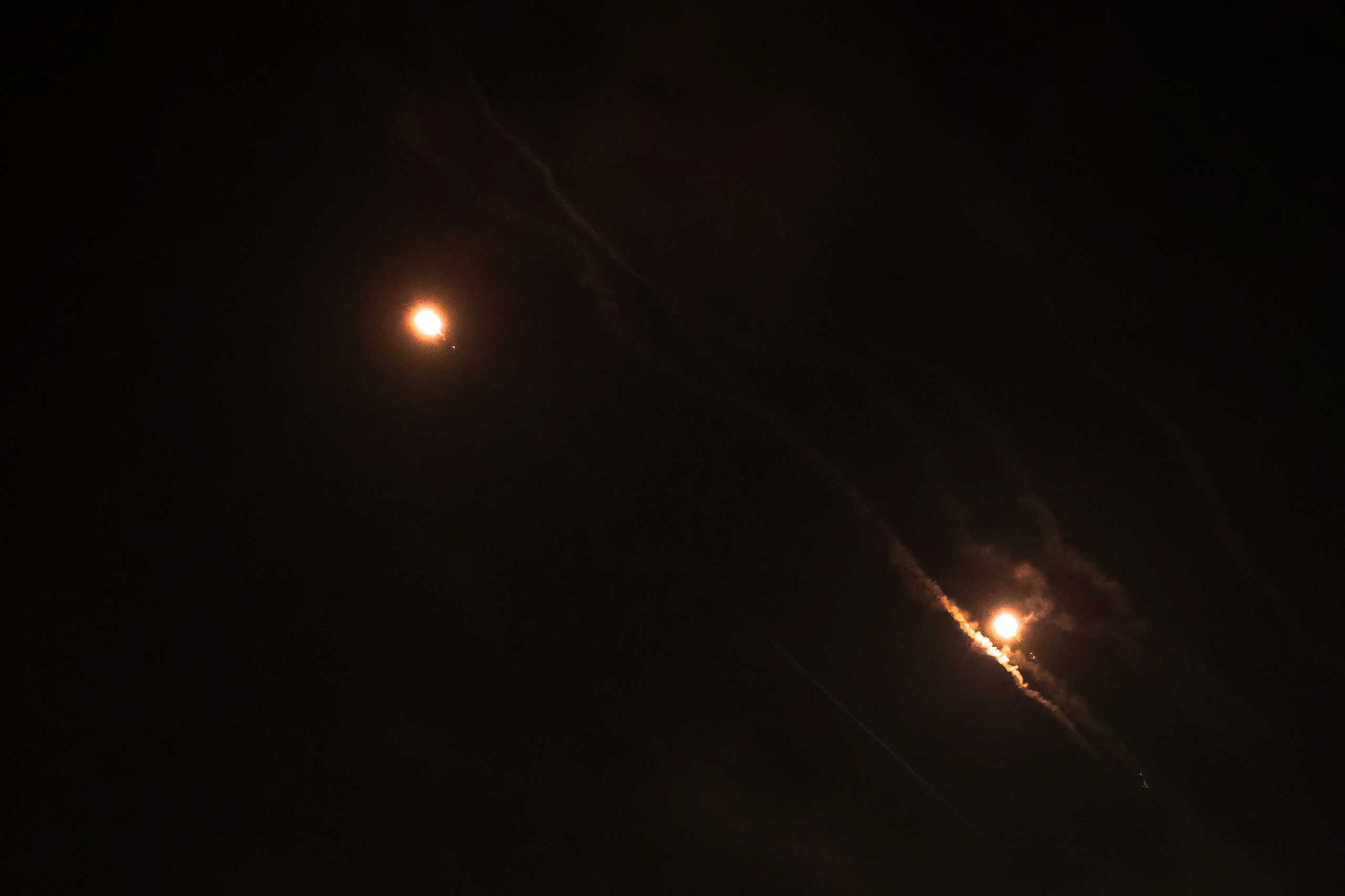 Objects are seen in the sky above Jerusalem after Iran launched drones and missiles towards Israel, in Jerusalem April 14, 2024. REUTERS