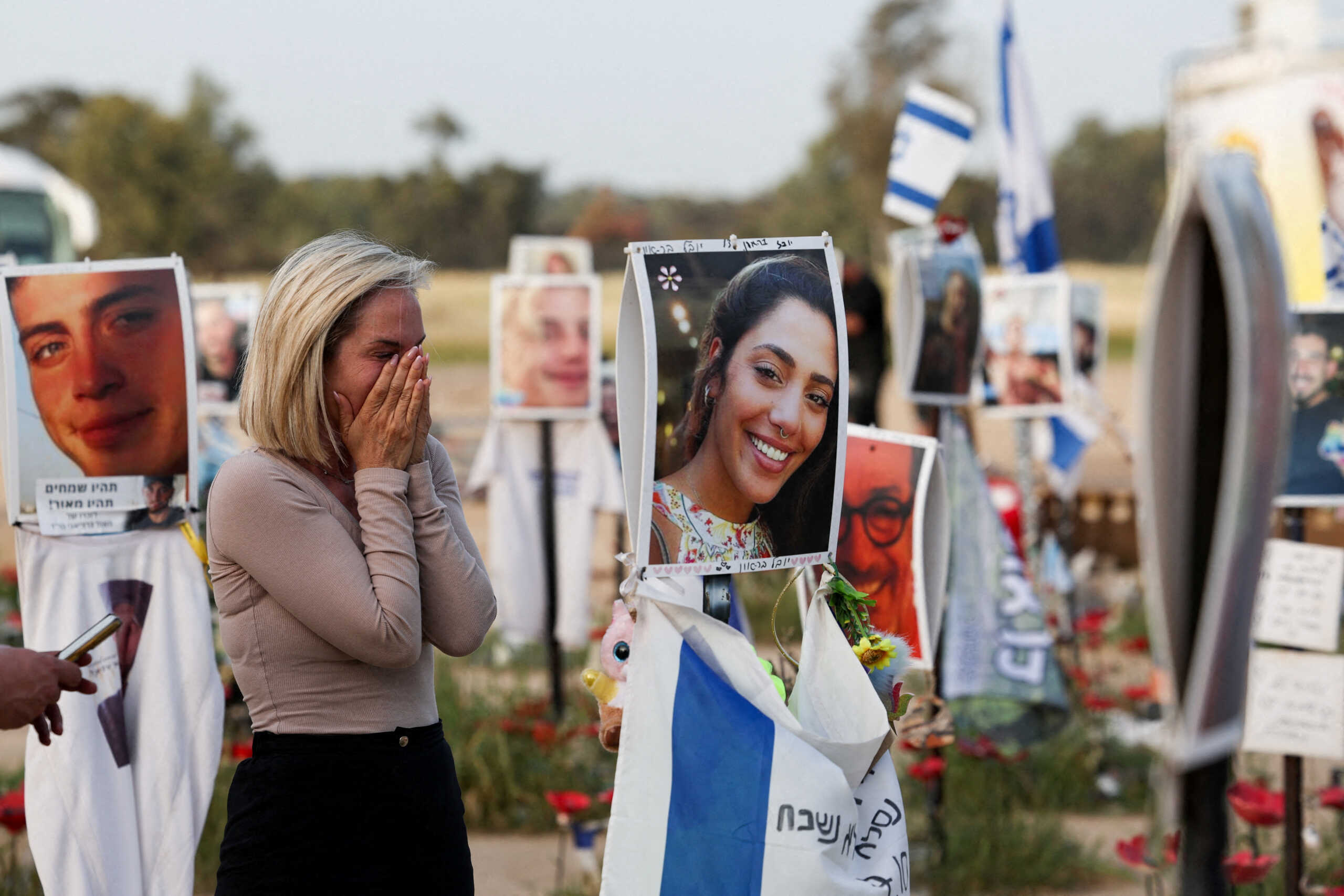 A woman reacts at the site of the Nova festival where people were killed and kidnapped during the October 7 attack by Hamas gunmen from Gaza, amid the ongoing conflict between Israel and the Palestinian Islamist group Hamas, in Reim, southern Israel, March 27, 2024. REUTERS