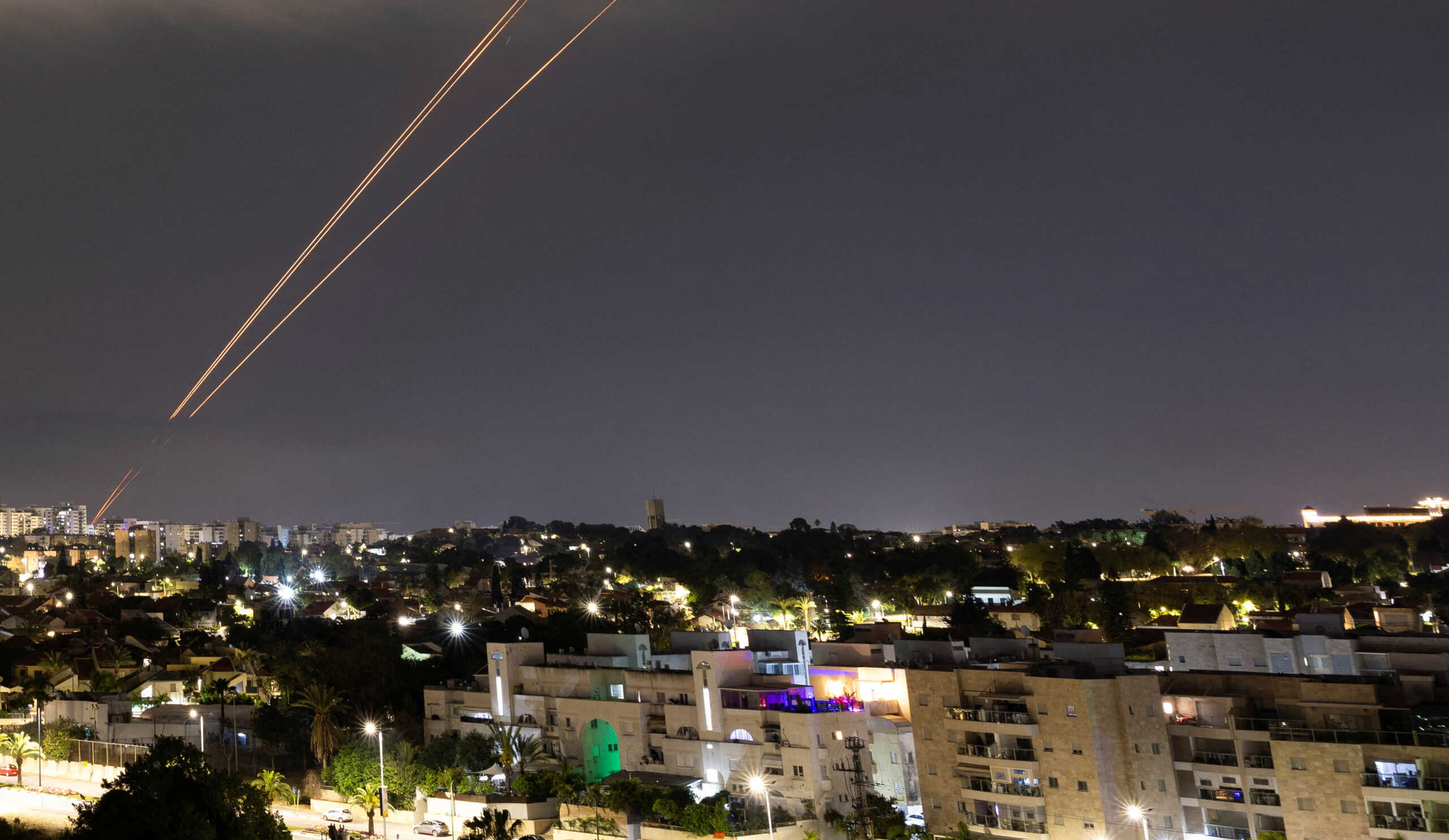 Objects are intercepted in the sky after Iran launched drones and missiles towards Israel, as seen from Ashkelon, Israel April 14, 2024. REUTERS