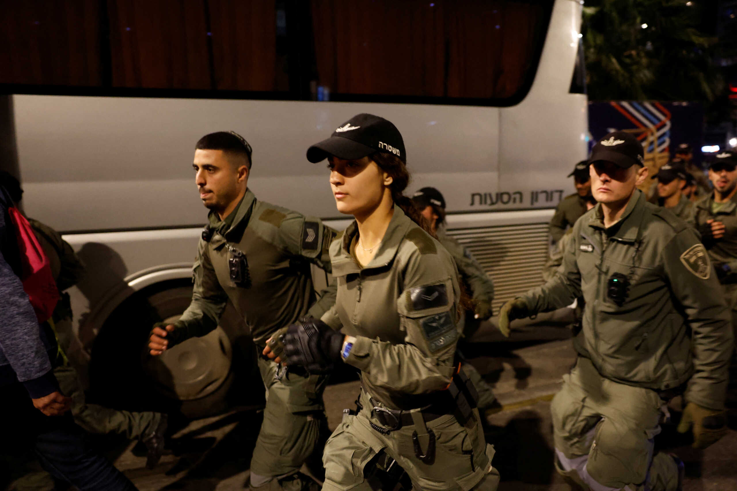 Police officers run while keeping watch during a protest against Israeli Prime Minister Benjamin Netanyahu's government and call for the release of hostages kidnapped in the deadly October 7 attack on Israel by the Palestinian Islamist group Hamas from Gaza, in Tel Aviv, Israel, March 23, 2024. REUTERS
