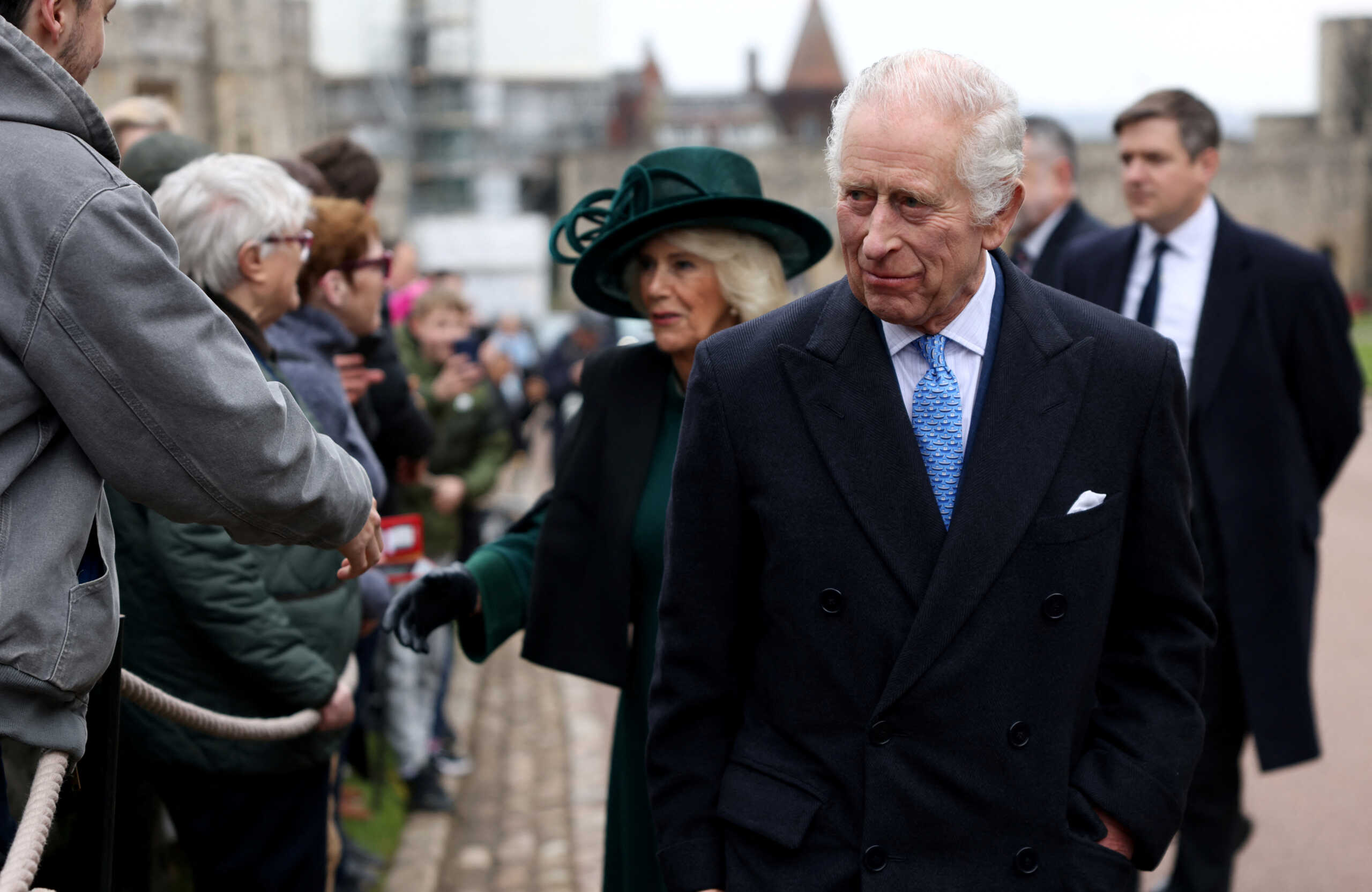 Britain's King Charles and Queen Camilla greet people after attending the Easter Matins Service at St. George's Chapel, Windsor Castle, Britain March 31, 2024. REUTERS