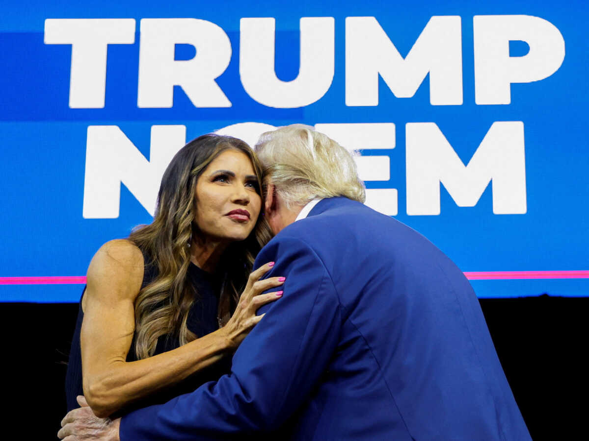 FILE PHOTO: South Dakota Governor Kristi Noem greets former U.S. President and Republican presidential candidate Donald Trump before he speaks at a South Dakota Republican party rally in Rapid City, South Dakota, U.S. September 8, 2023. REUTERS