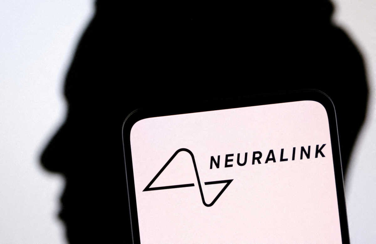 FILE PHOTO: Neuralink logo and Elon Musk silhouette are seen in this illustration taken, December 19, 2022. REUTERS