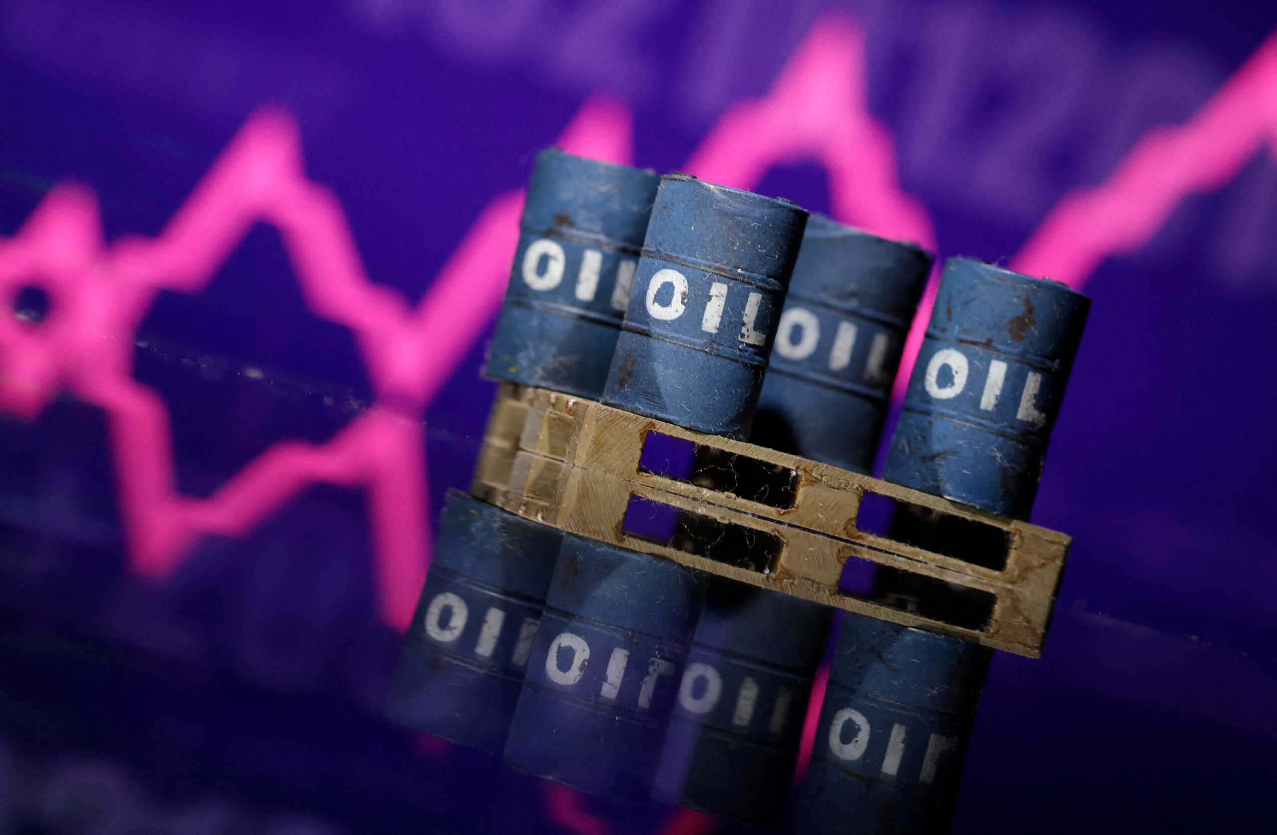 FILE PHOTO: Miniatures of oil barrels and a rising stock graph are seen in this illustration taken January 15, 2024. REUTERS