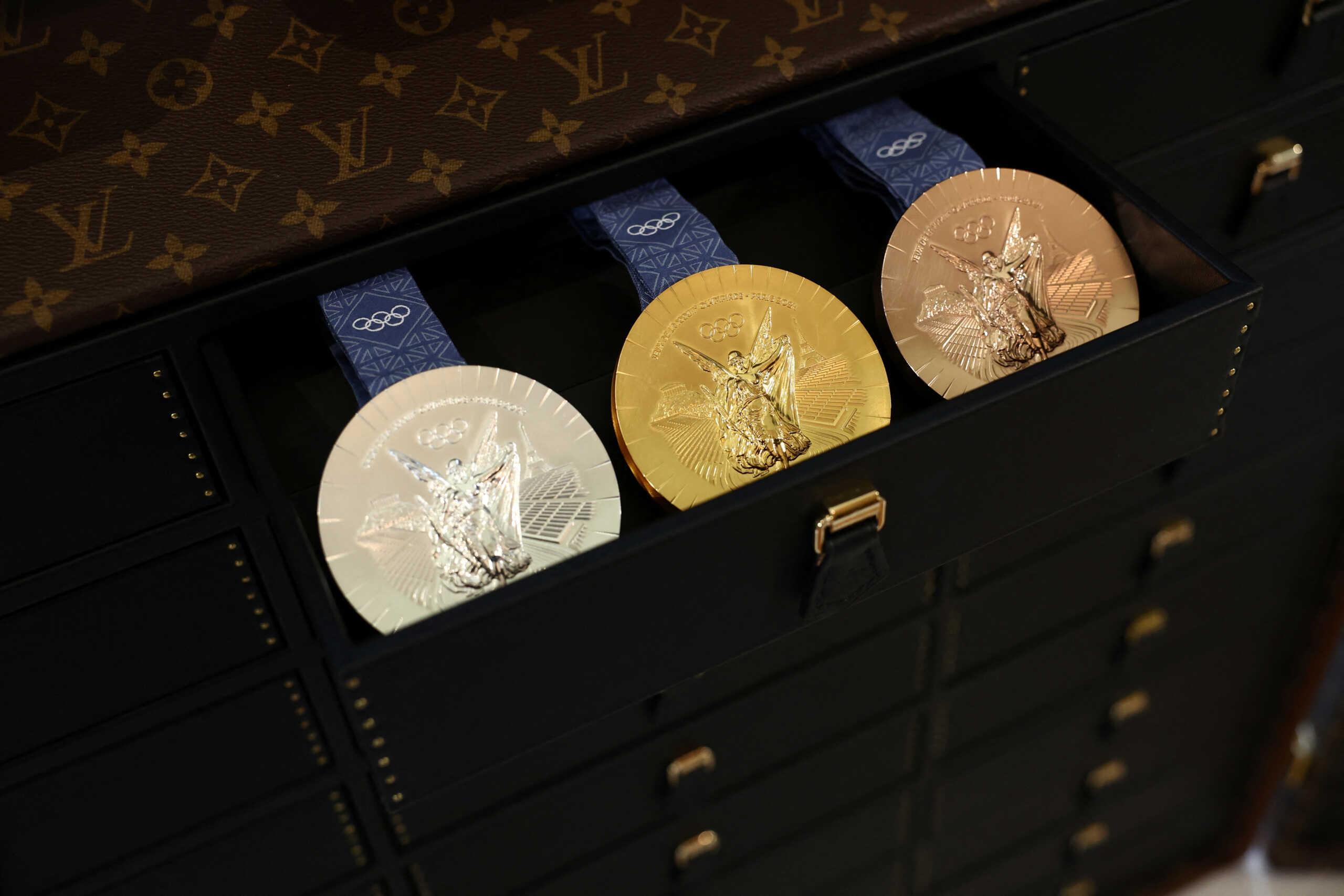 A drawer with Olympics gold, silver and bronze medals is seen in a Louis Vuitton Medals Trunk, which will transport and protect the medals during the Paris 2024 Olympic and Paralympic Games, during a press visit at the Louis Vuitton workshops in Asnieres-sur-Seine near Paris, France, March 27, 2024. REUTERS
