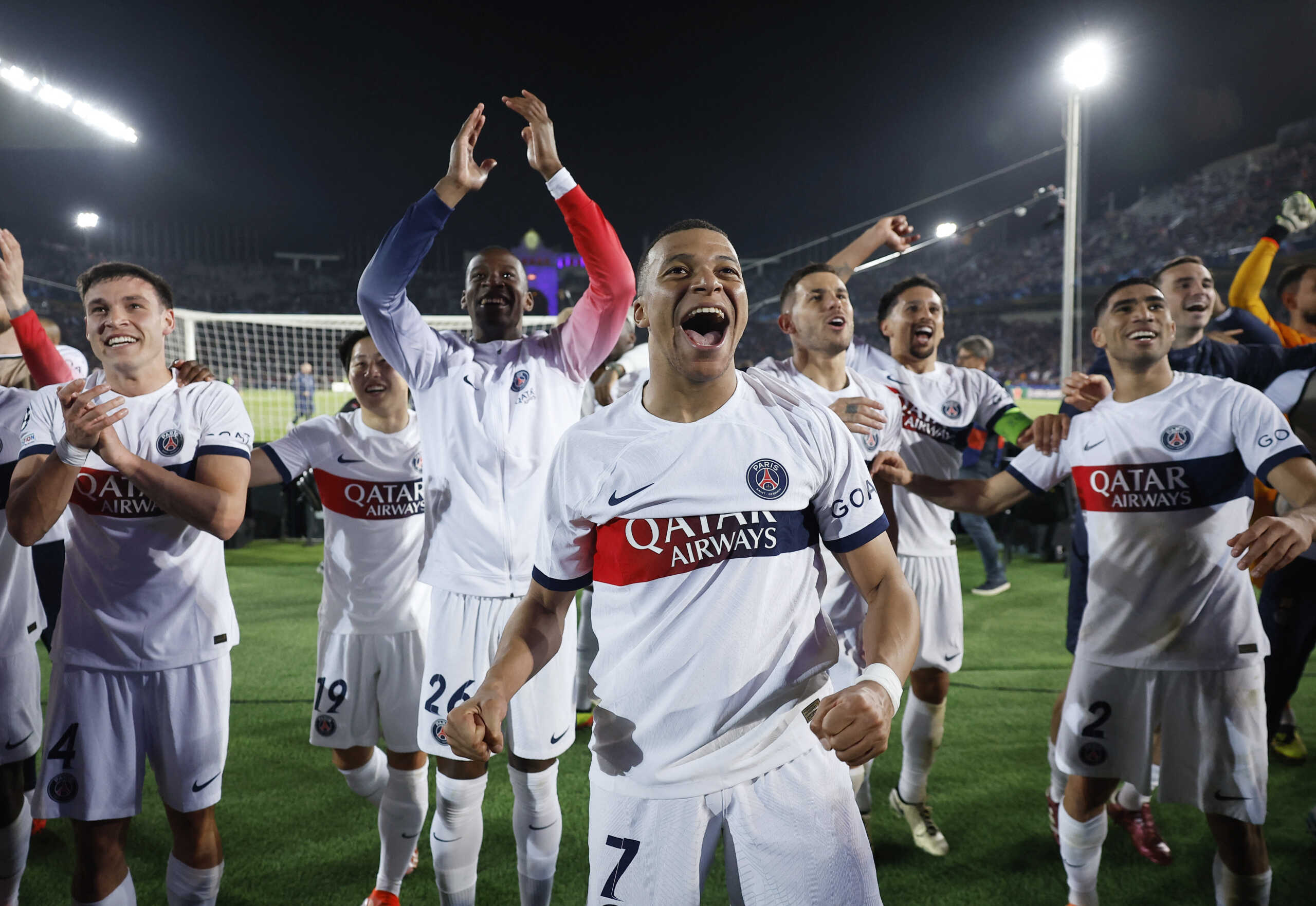 Soccer Football - Champions League - Quarter Final - Second Leg - FC Barcelona v Paris St Germain - Estadi Olimpic Lluis Companys, Barcelona, Spain - April 16, 2024 Paris St Germain's Kylian Mbappe with teammates celebrate after the match REUTERS
