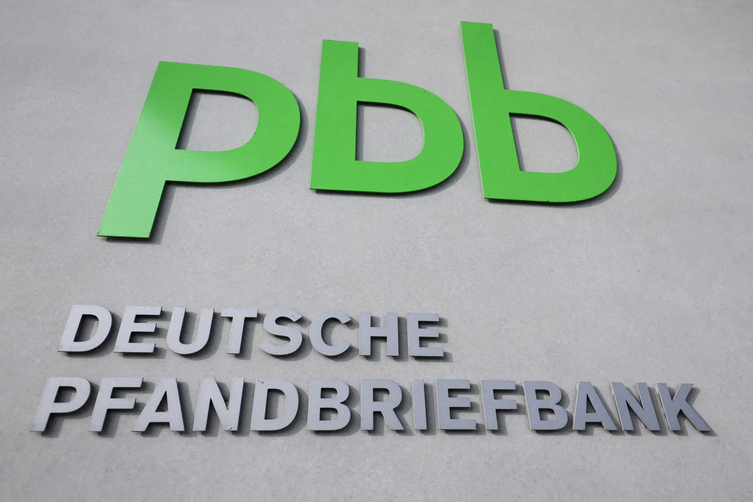 FILE PHOTO: The logo of troubled German property lender Deutsche Pfandbriefbank pbb is pictured at its headquarters as the real estate crisis widens, in Garching near Munich, Germany February 18, 2024.       REUTERS