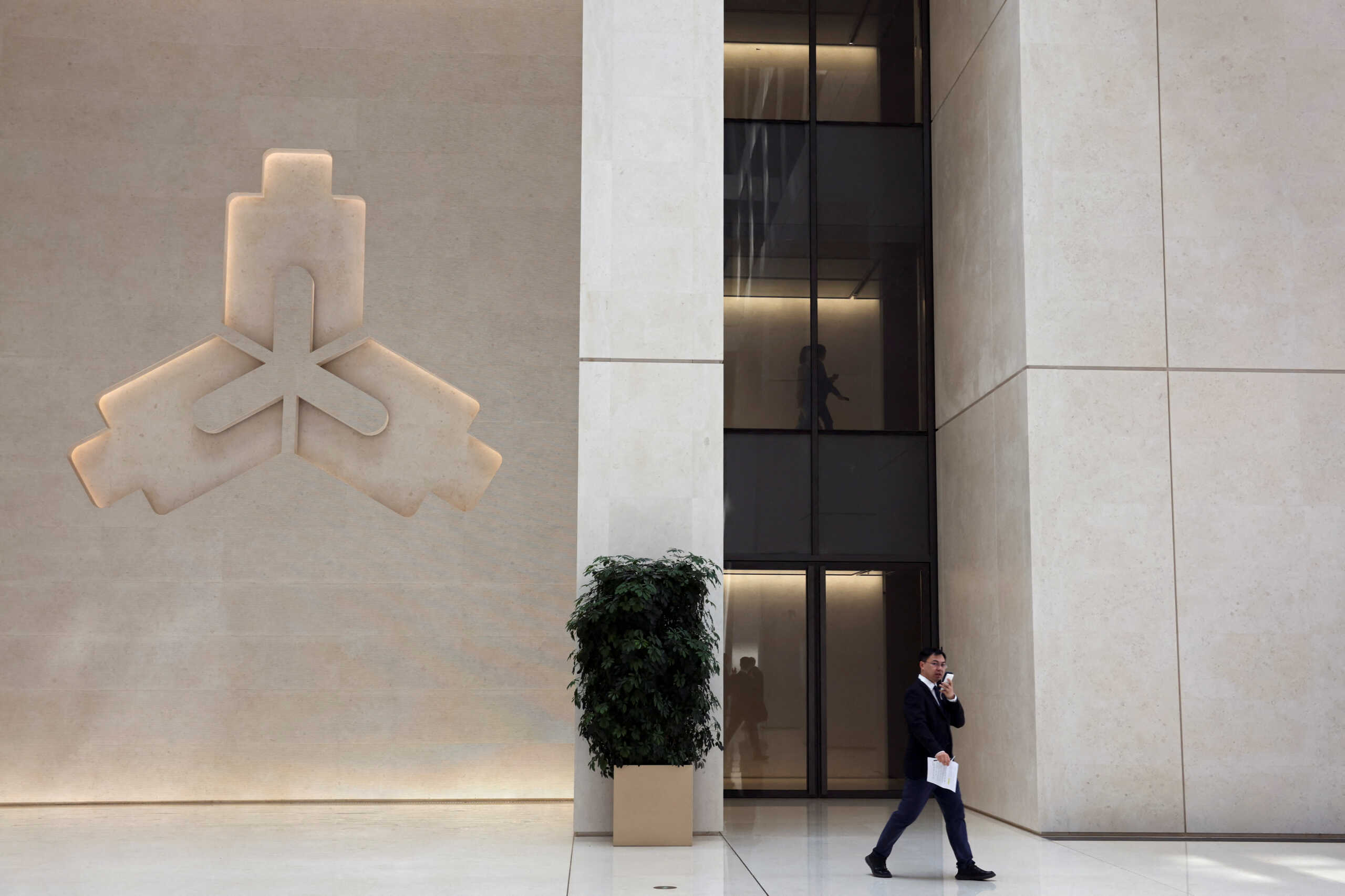 A man walks past a People's Bank of China (PBOC) sign in Beijing, China April 8, 2024. REUTERS