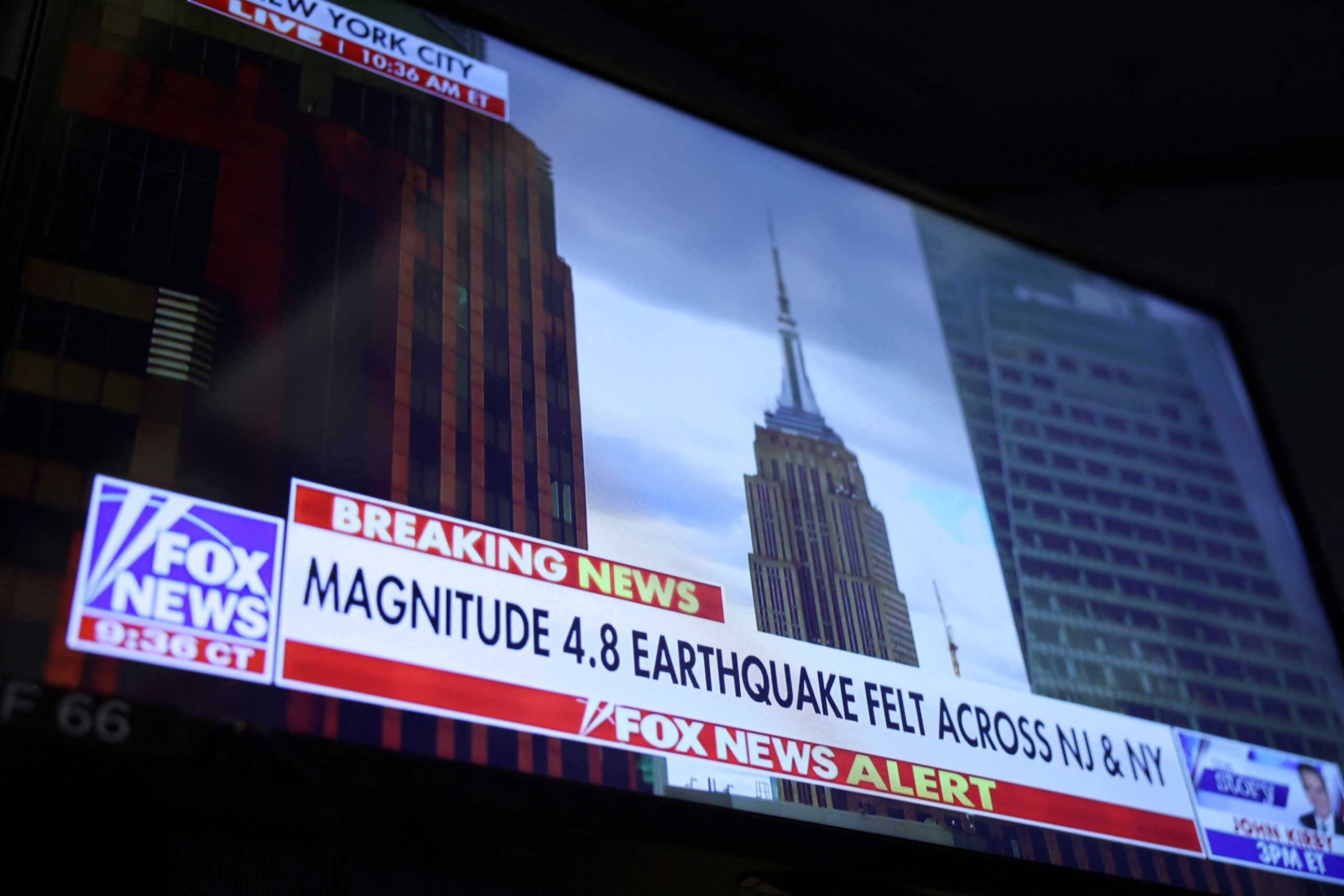 A screen at the New York Stock Exchange (NYSE) shows a news alert of a magnitude 4.8 earthquake in New York City, U.S., April 5, 2024. REUTERS