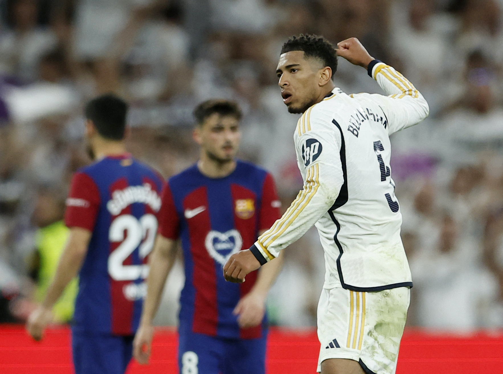 Soccer Football - LaLiga - Real Madrid v FC Barcelona - Santiago Bernabeu, Madrid, Spain - April 21, 2024 Real Madrid's Jude Bellingham celebrates scoring their third goal REUTERS