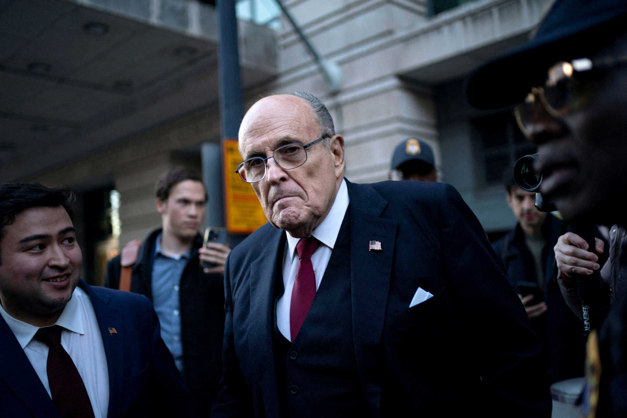 FILE PHOTO: Former New York Mayor Rudy Giuliani departs the U.S. District Courthouse after he was ordered to pay $148 million in his defamation case in Washington, U.S., December 15, 2023. REUTERS