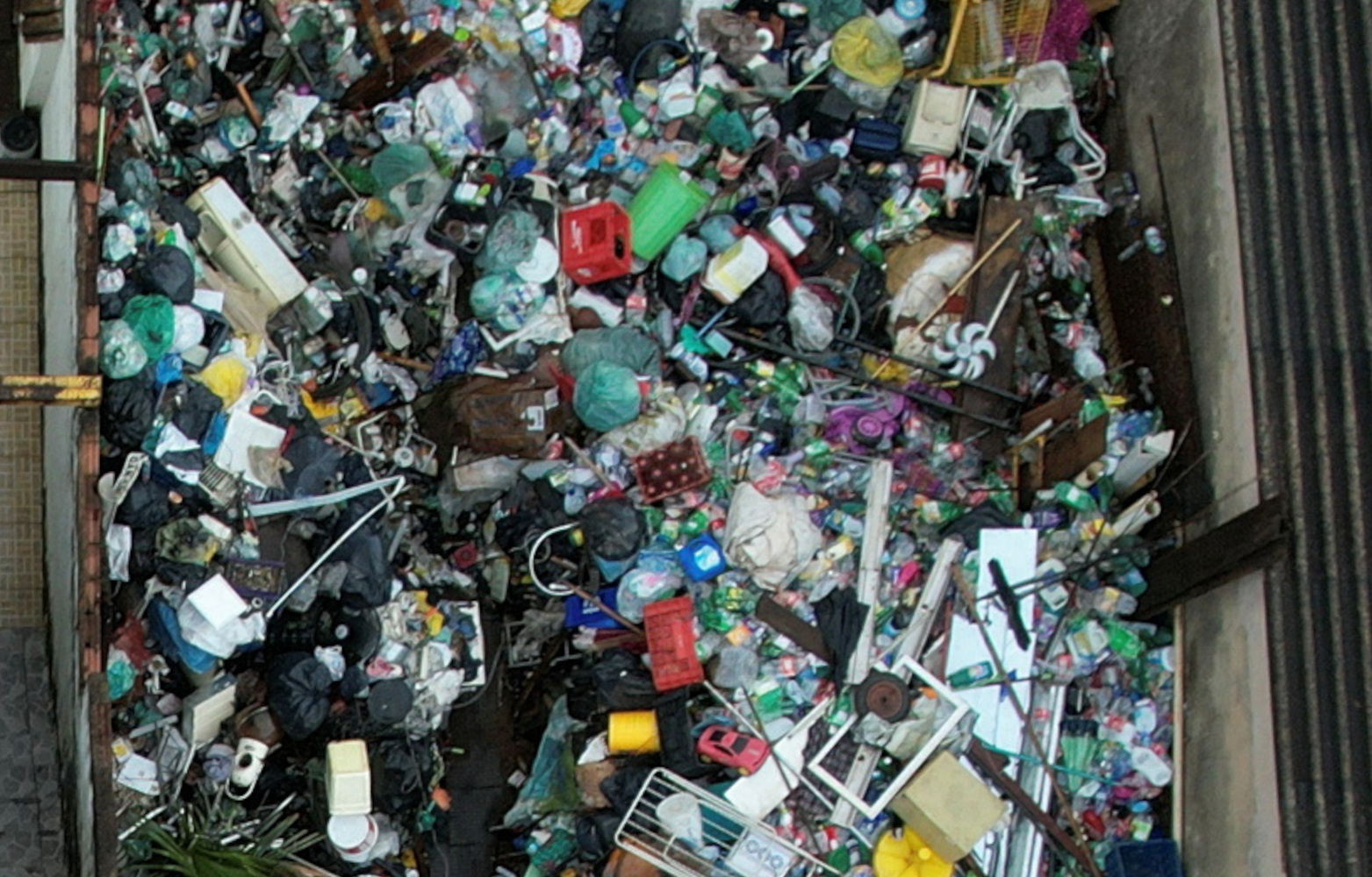 A drone view shows large amounts of garbage and recyclable materials collected from a house during a dengue outbreak, in the outskirts of Brasilia, Brazil, March 14, 2024. REUTERS