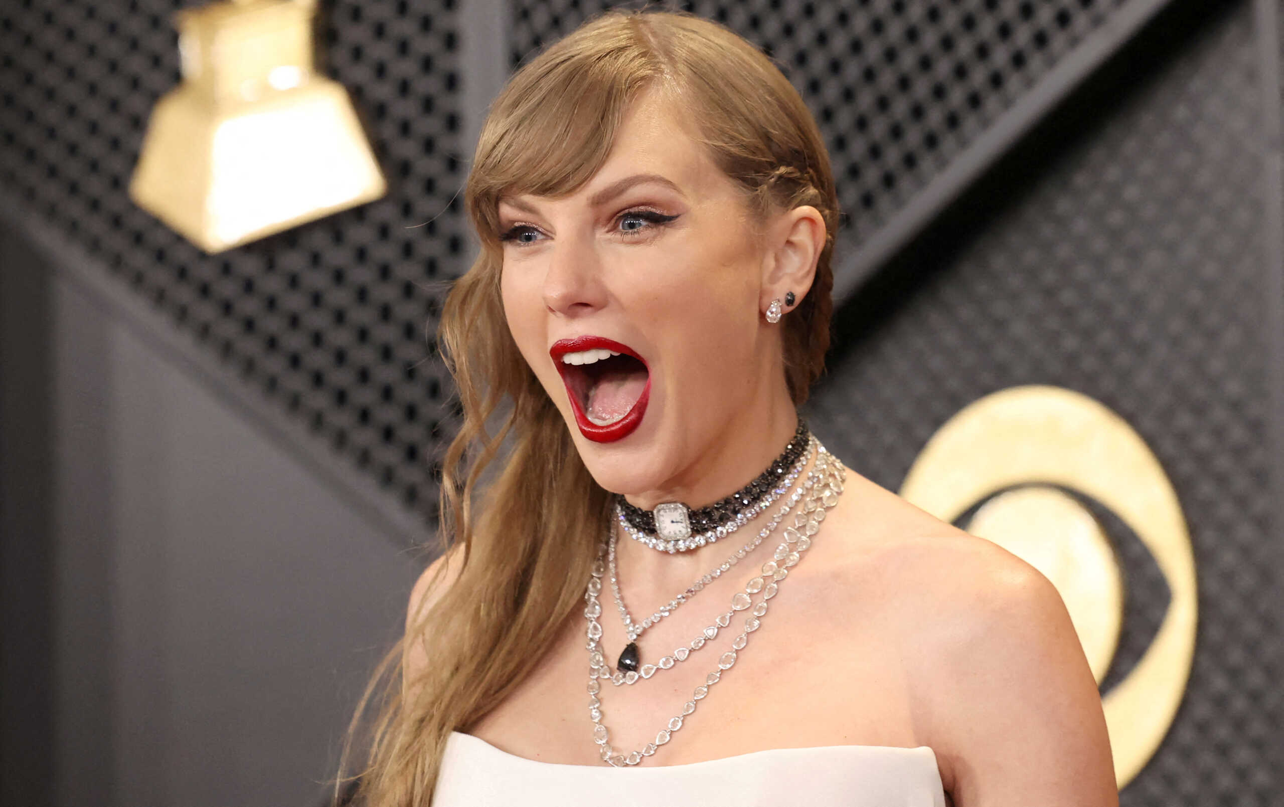FILE PHOTO: Taylor Swift poses on the red carpet as she attends the 66th Annual Grammy Awards in Los Angeles, California, U.S., February 4, 2024.  REUTERS