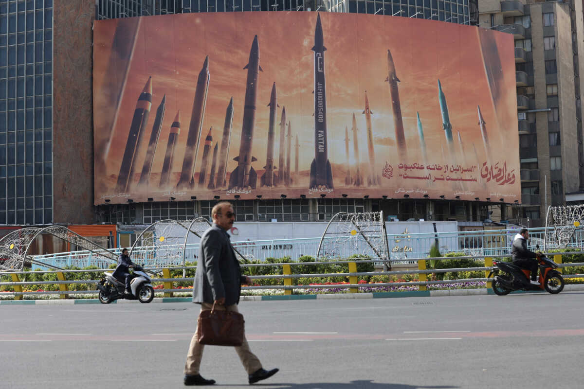 An anti-Israel billboard with a picture of Iranian missiles is seen in a street in Tehran, Iran April 15, 2024. Majid Asgaripour