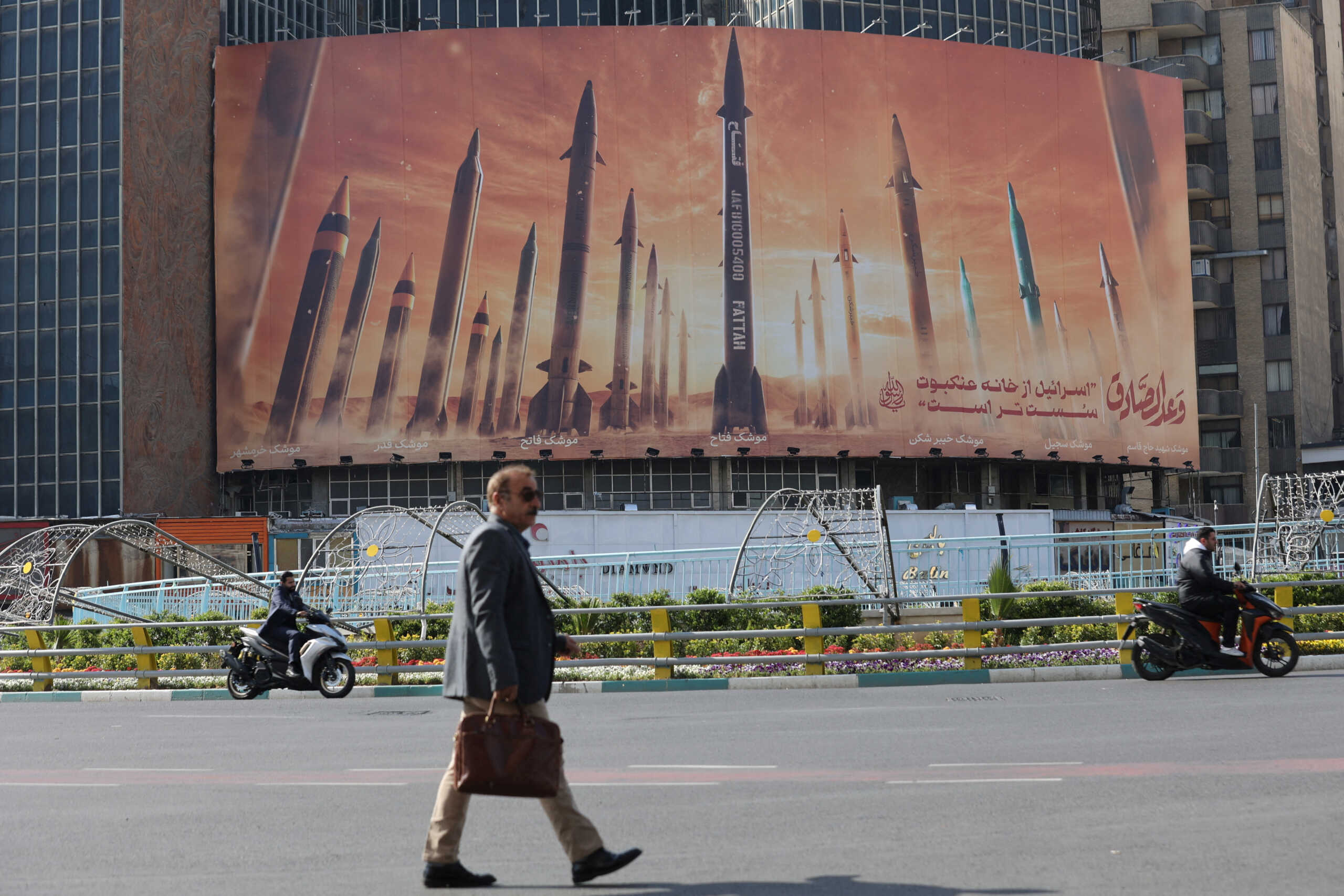 An anti-Israel billboard with a picture of Iranian missiles is seen in a street in Tehran, Iran April 15, 2024. Majid Asgaripour