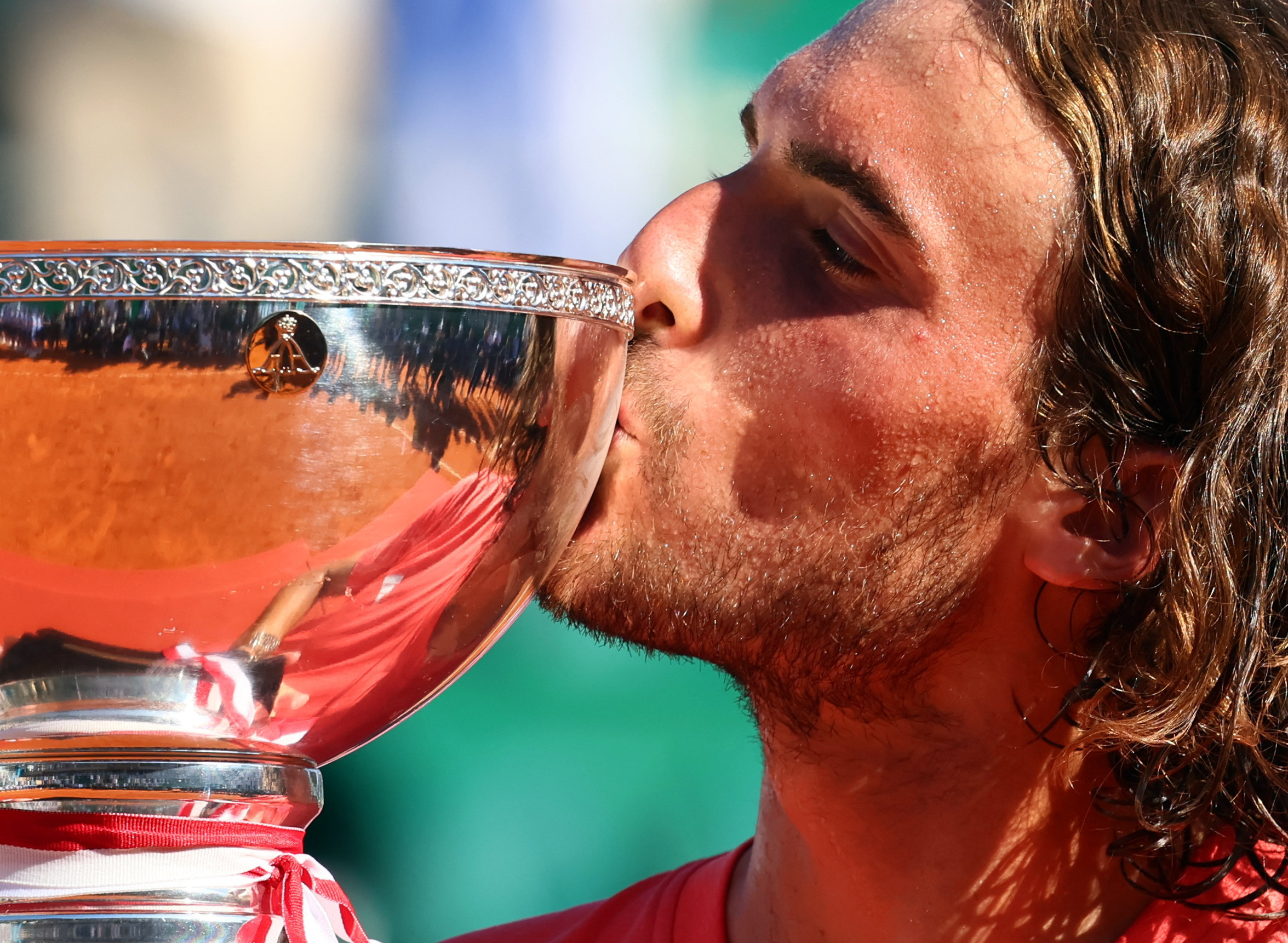 Tennis - ATP Masters 1000 - Monte Carlo Masters - Monte Carlo Country Club, Roquebrune-Cap-Martin, France - April 14, 2024 Greece's Stefanos Tsitsipas kisses the trophy after winning his final match against Norway's Casper Ruud REUTERS