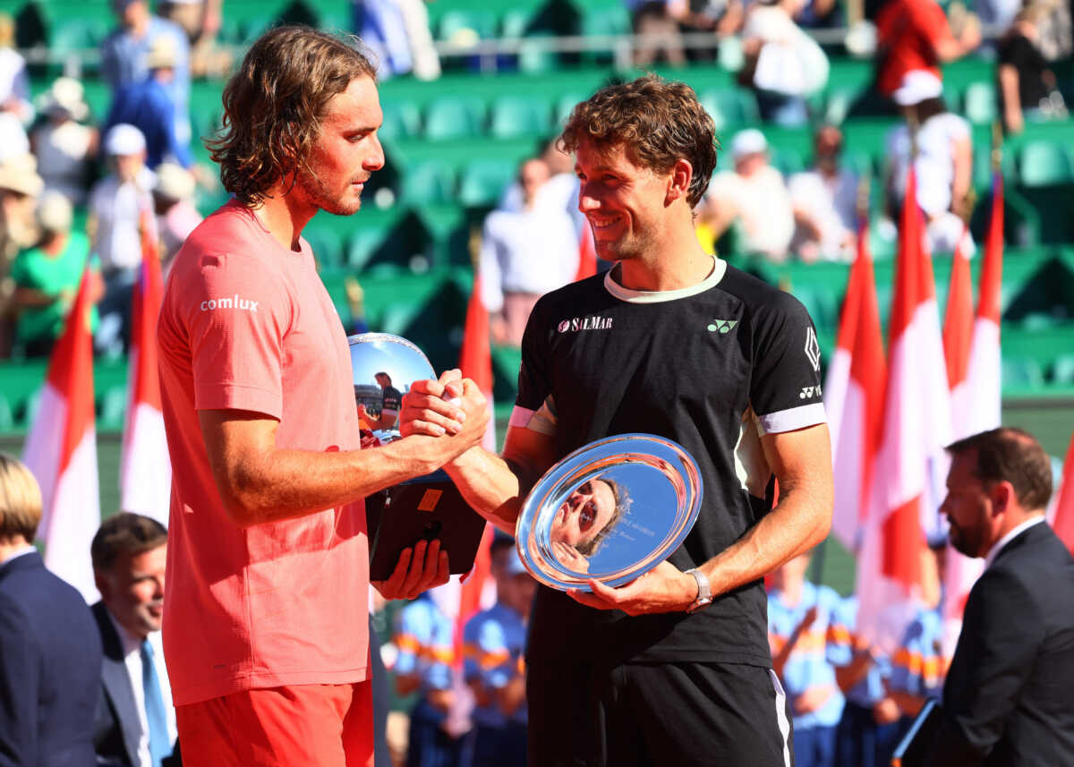 Tennis - ATP Masters 1000 - Monte Carlo Masters - Monte Carlo Country Club, Roquebrune-Cap-Martin, France - April 14, 2024 Greece's Stefanos Tsitsipas celebrates with the trophy after winning his final match against Norway's Casper Ruud REUTERS