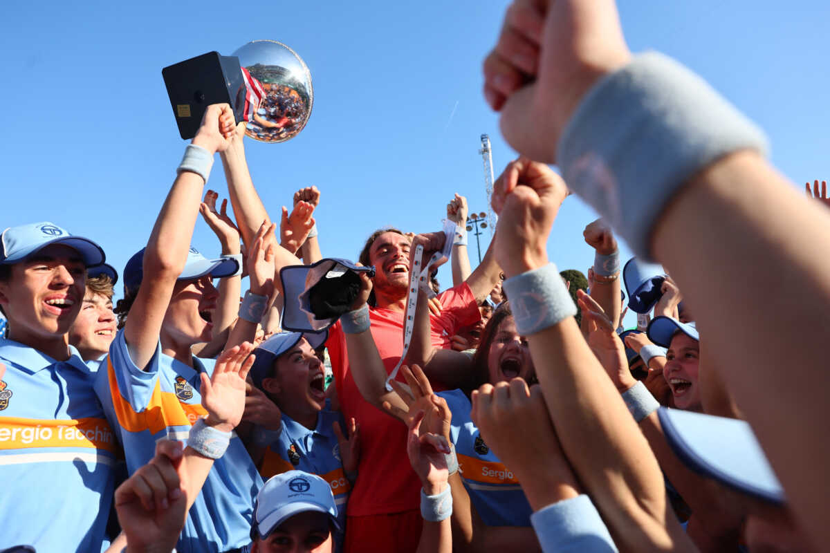 Tennis - ATP Masters 1000 - Monte Carlo Masters - Monte Carlo Country Club, Roquebrune-Cap-Martin, France - April 14, 2024 Greece's Stefanos Tsitsipas celebrates with the trophy and with the ball kids after winning his final match against Norway's Casper Ruud REUTERS