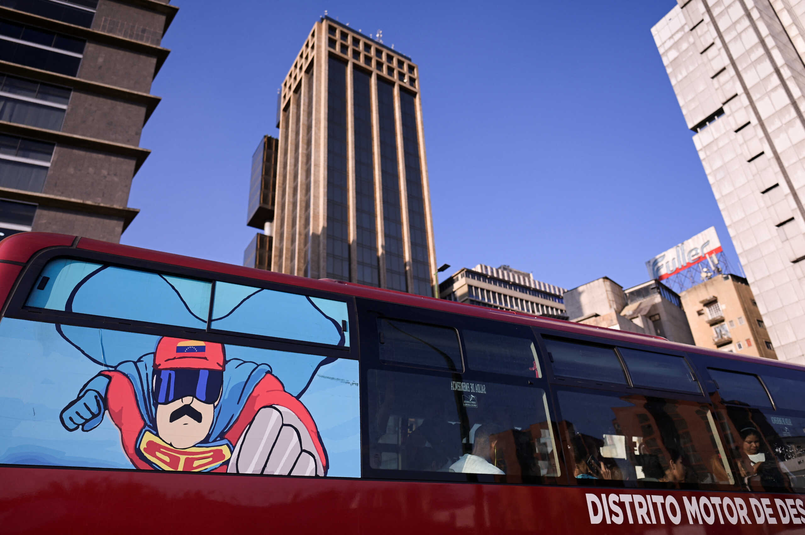 A poster with the "Super Bigote" (Super Mustache) superhero inspired by Venezuelan President Nicolas Maduro is displayed on a bus, in Caracas, Venezuela March 27, 2024. REUTERS