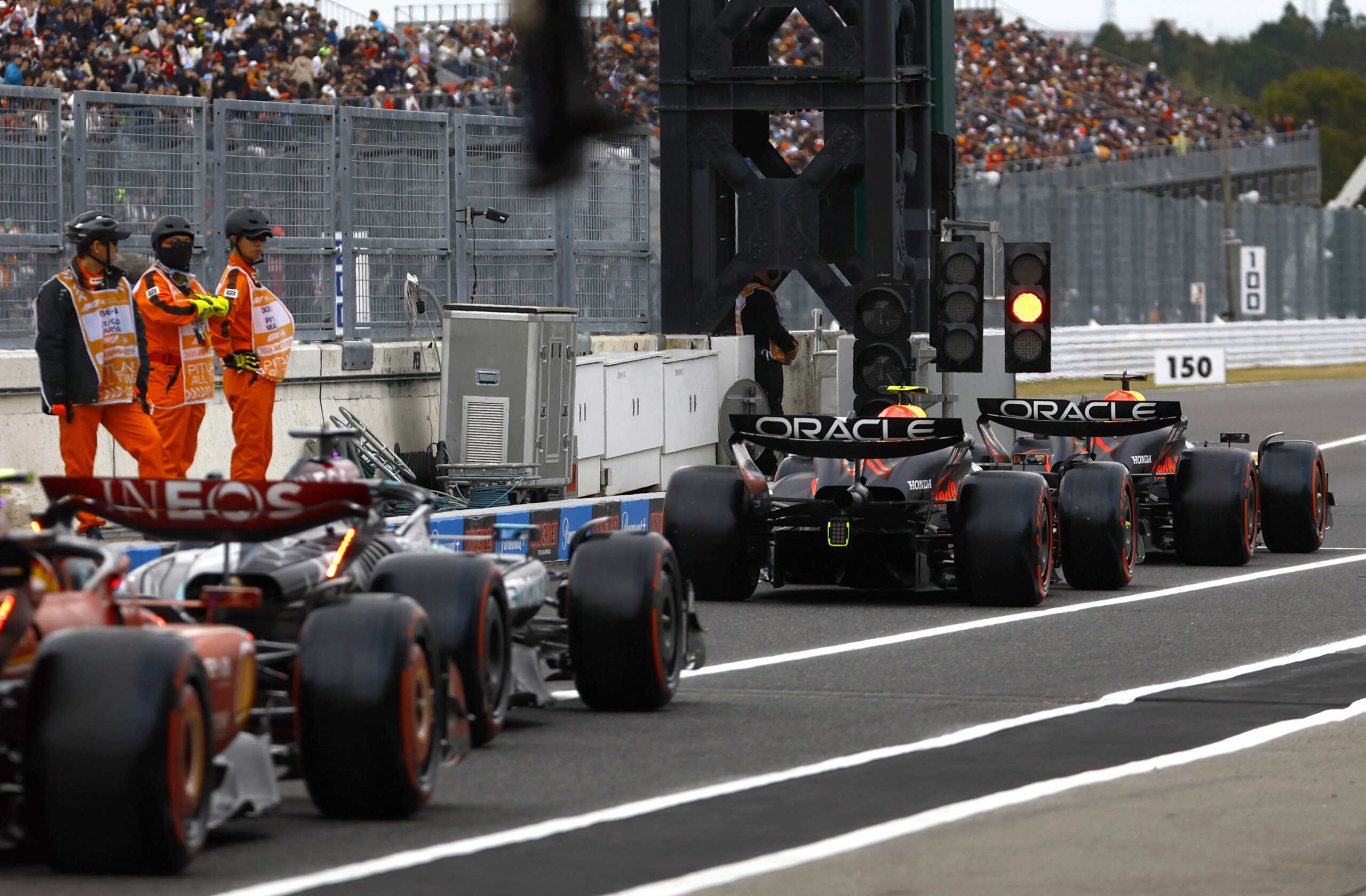 Formula One F1 - Japanese Grand Prix - Suzuka Circuit, Suzuka, Japan - April 5, 2024 Red Bull's Max Verstappen, Red Bull's Sergio Perez and drivers await to restart practice after a red flag REUTERS