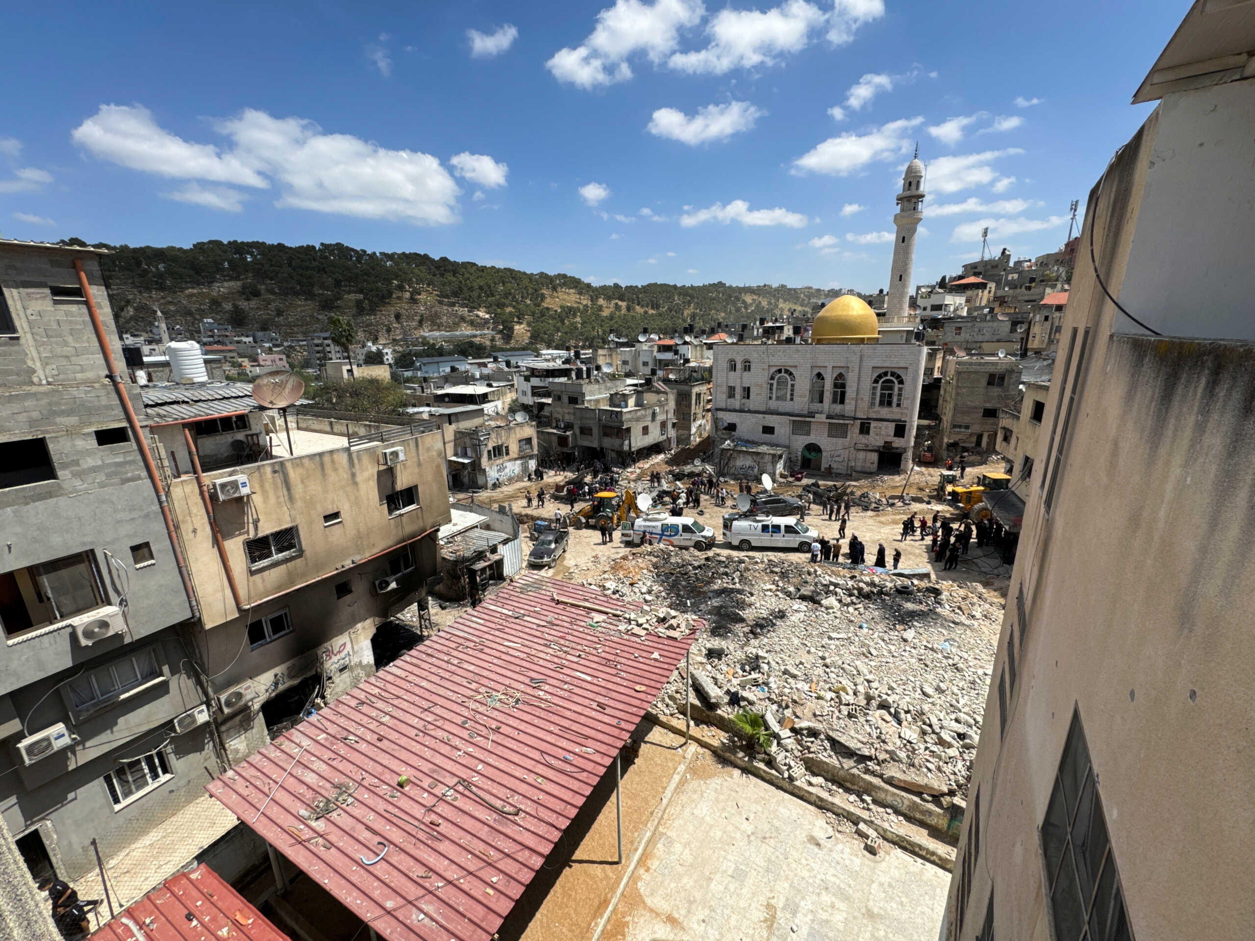 Palestinians inspect the damage following an Israeli raid at Nur Shams camp, in Tulkarm, in the Israeli-occupied West Bank, April 21, 2024. REUTERS