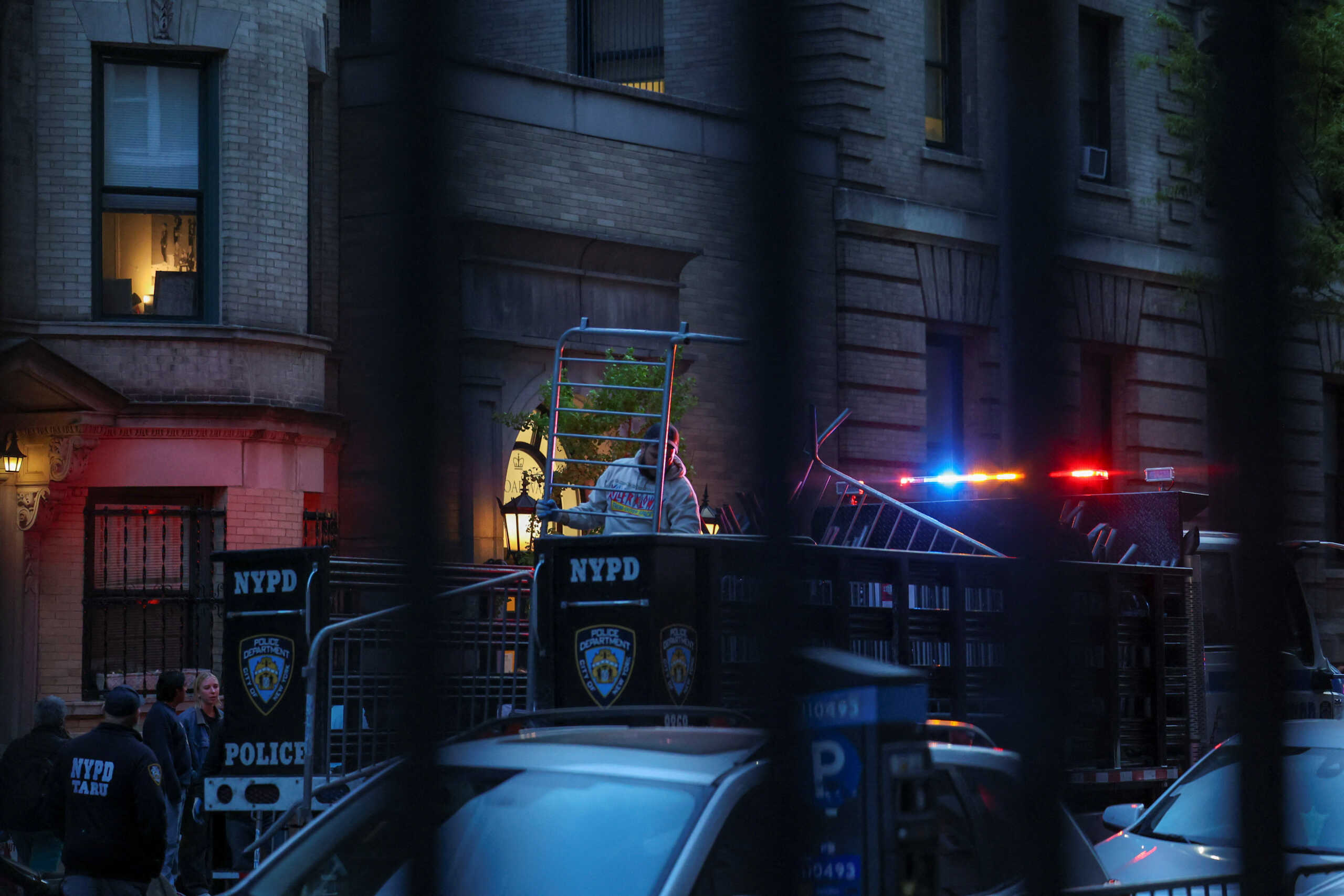 NYPD law enforcement officials put up barricades around the entrances to Columbia University, where students escalated protests in support of Palestinians by barricading themselves inside Hamilton Hall, despite orders from university officials to disband, or face suspension, during the ongoing conflict between Israel and the Palestinian Islamist group Hamas, in New York City, U.S., April 30, 2024. REUTERS