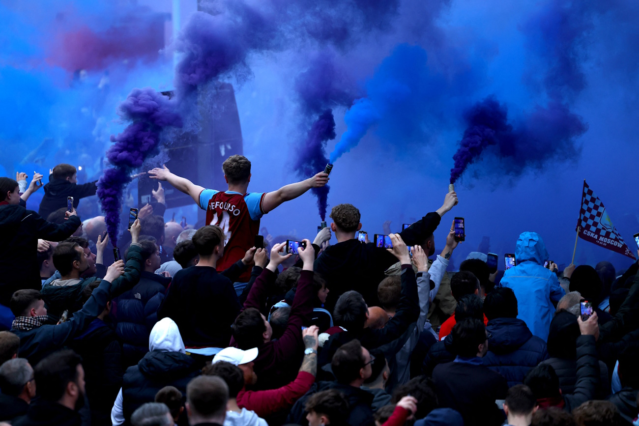 Soccer Football - Europa Conference League - Semi Final - First Leg - Aston Villa v Olympiacos - Villa Park, Birmingham, Britain - May 2, 2024  Aston Villa fans with flares outside the stadium before the match REUTERS