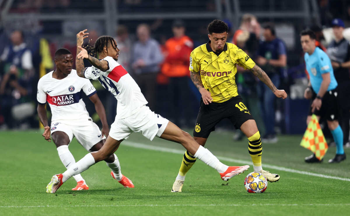 Soccer Football - Champions League - Semi Final - First Leg - Borussia Dortmund v Paris St Germain - Signal Iduna Park, Dortmund, Germany - May 1, 2024 Paris St Germain's Bradley Barcola in action with Borussia Dortmund's Jadon Sancho REUTERS