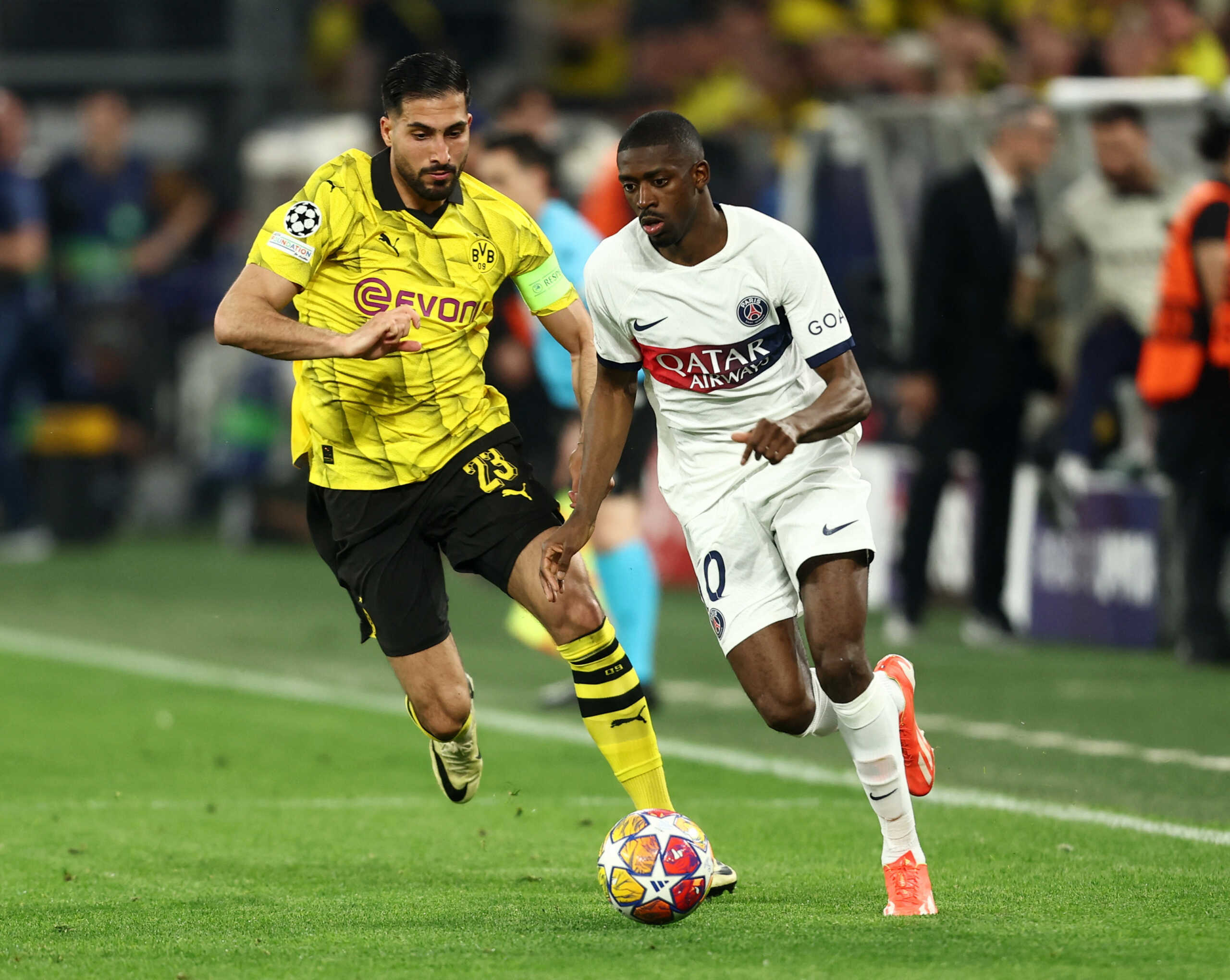 Soccer Football - Champions League - Semi Final - First Leg - Borussia Dortmund v Paris St Germain - Signal Iduna Park, Dortmund, Germany - May 1, 2024 Borussia Dortmund's Emre Can in action with Paris St Germain's Ousmane Dembele REUTERS