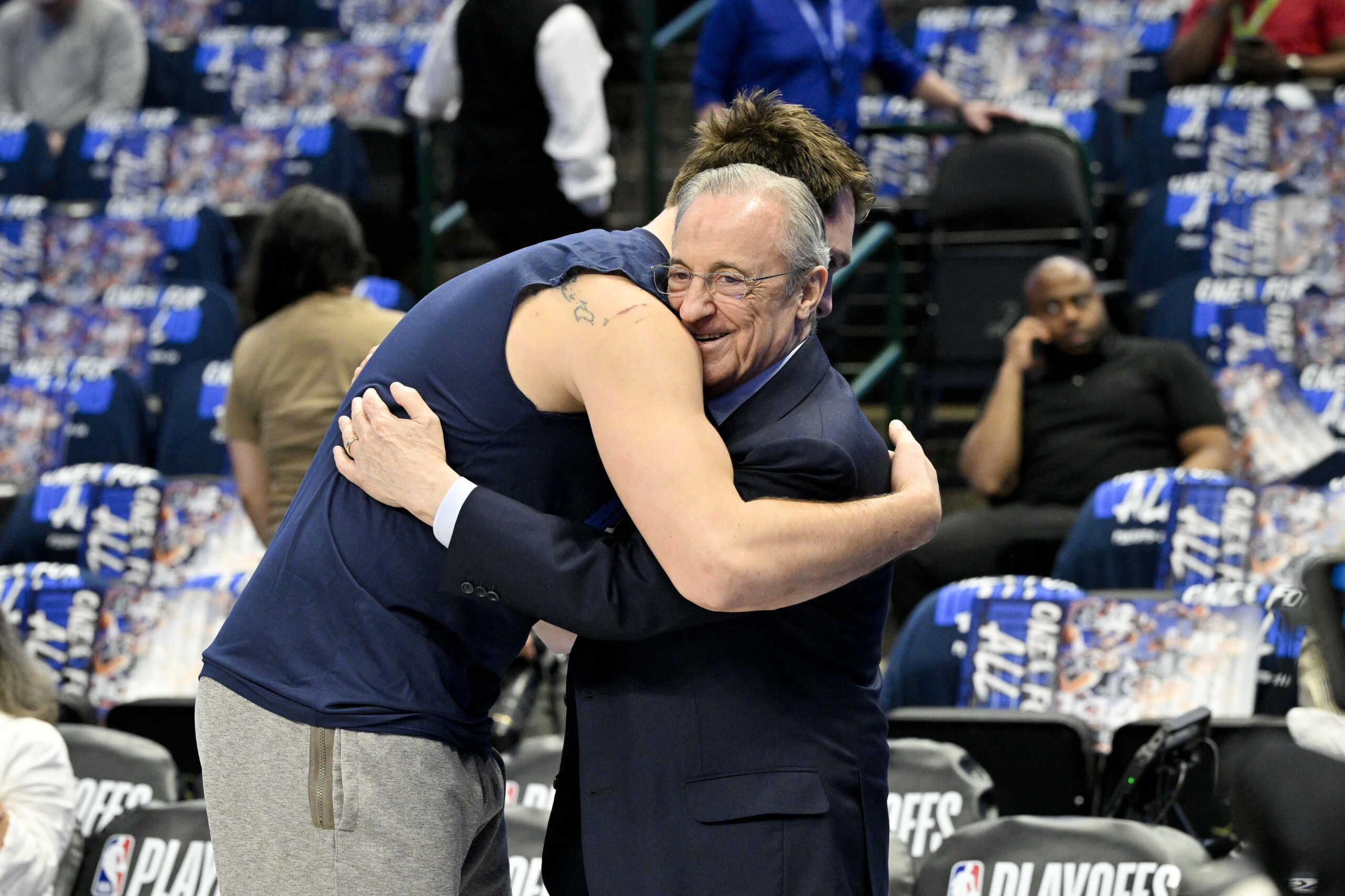 Apr 26, 2024; Dallas, Texas, USA; Dallas Mavericks guard Luka Doncic (left) hugs Real Madrid president Florentino Perez (right) before the game between the Dallas Mavericks and the LA Clippers during game three of the first round for the 2024 NBA playoffs at the American Airlines Center. Mandatory Credit: Jerome Miron-USA TODAY Sports