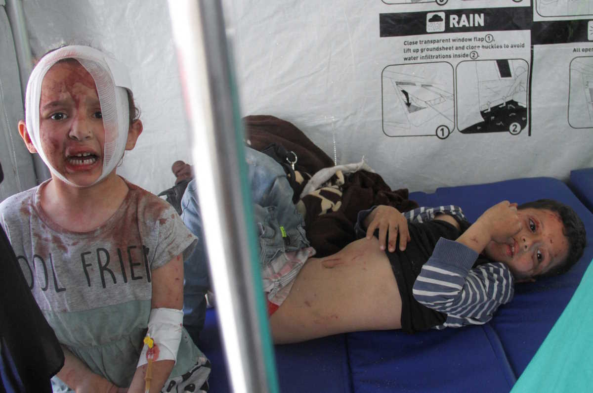 A Palestinian child, wounded in Israeli fire during an Israeli invasion in Jabalia refugee camp, lays in a tent inside of Kamal Adwan hospital, amid the ongoing conflict between Israel and Hamas, in northern Gaza Strip, May 13, 2024. REUTERS