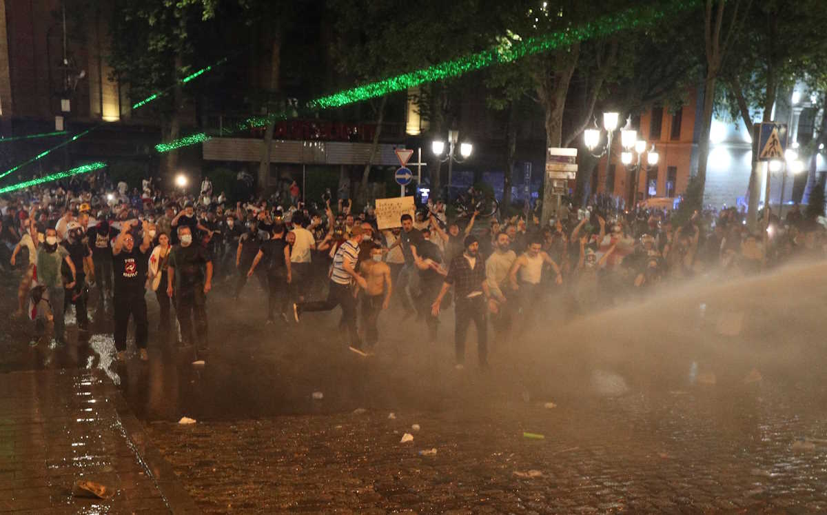 Law enforcement officers use a water cannon to disperse the crowd near the parliament building during a rally to protest against a bill on "foreign agents" in Tbilisi, Georgia, April 30, 2024. Georgian parliament is set to debate the second reading of the bill described as authoritarian and Russian-inspired by Georgia's opposition and Western countries. REUTERS