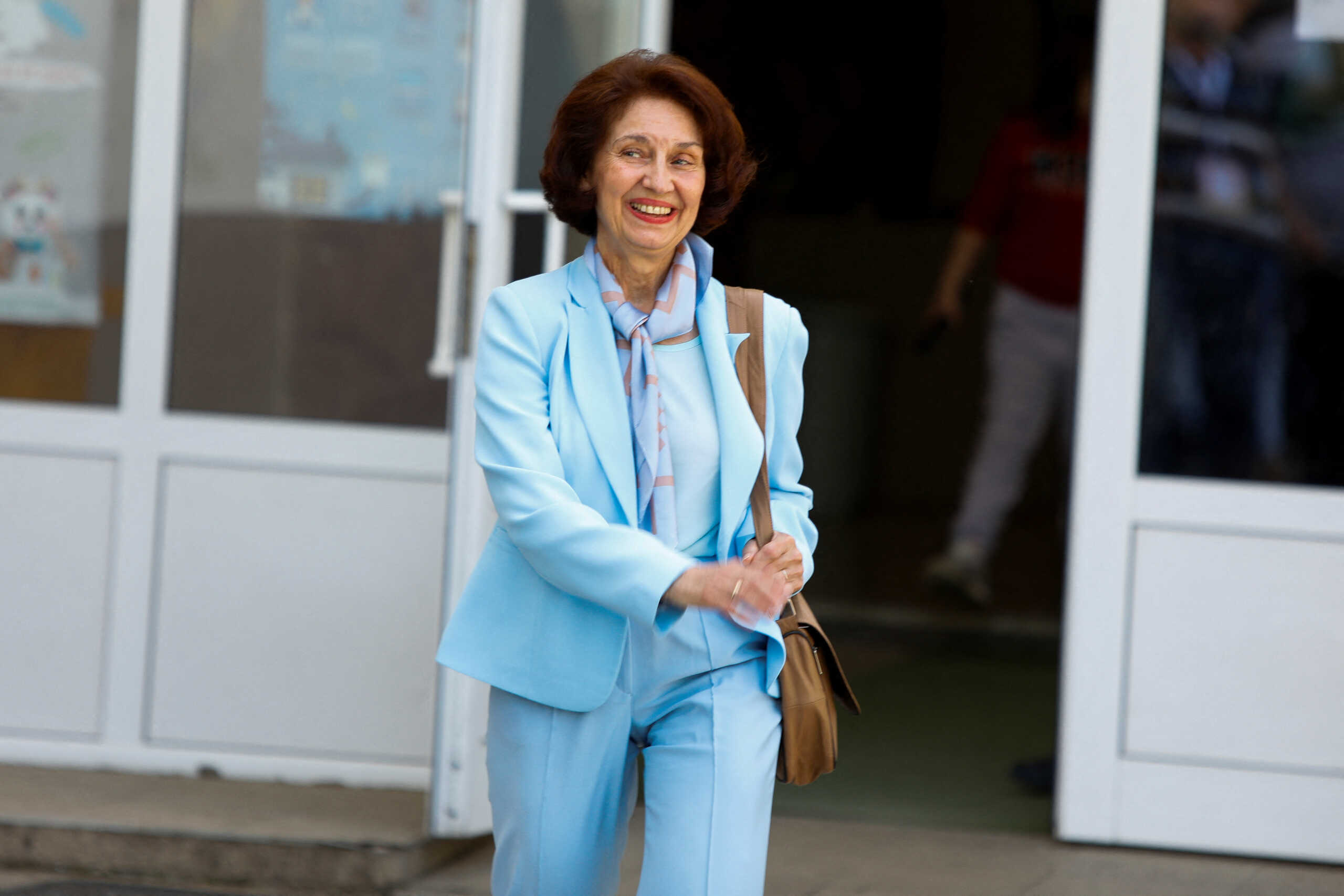 North Macedonia's biggest opposition party VMRO-DPMNE's presidential candidate Gordana Siljanovska-Davkova walks on the day of the parliamentary elections and second round of the presidential elections in Skopje, North Macedonia, May 8, 2024. REUTERS