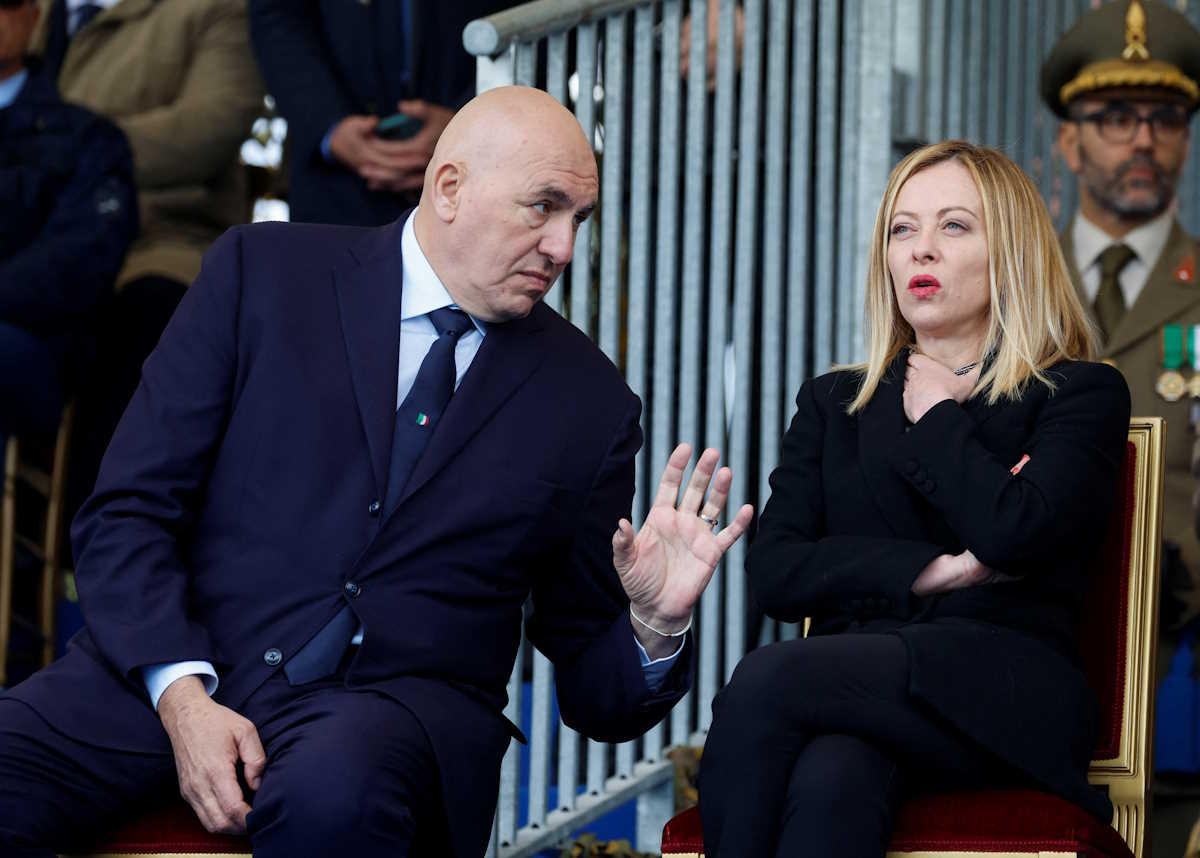 Italy's Prime Minister Giorgia Meloni looks on next to Italy's Defence Minister Guido Crosetto as they attend a ceremony to mark the 163rd anniversary of the Italian Army, in Rome, Italy, May 3, 2024. REUTERS