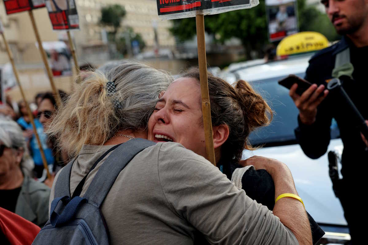 Women hug during a protest calling for the release of hostages kidnapped in the deadly October 7 attack on Israel by the Palestinian Islamist group Hamas from Gaza, in Tel Aviv, Israel, May 2, 2024. REUTERS