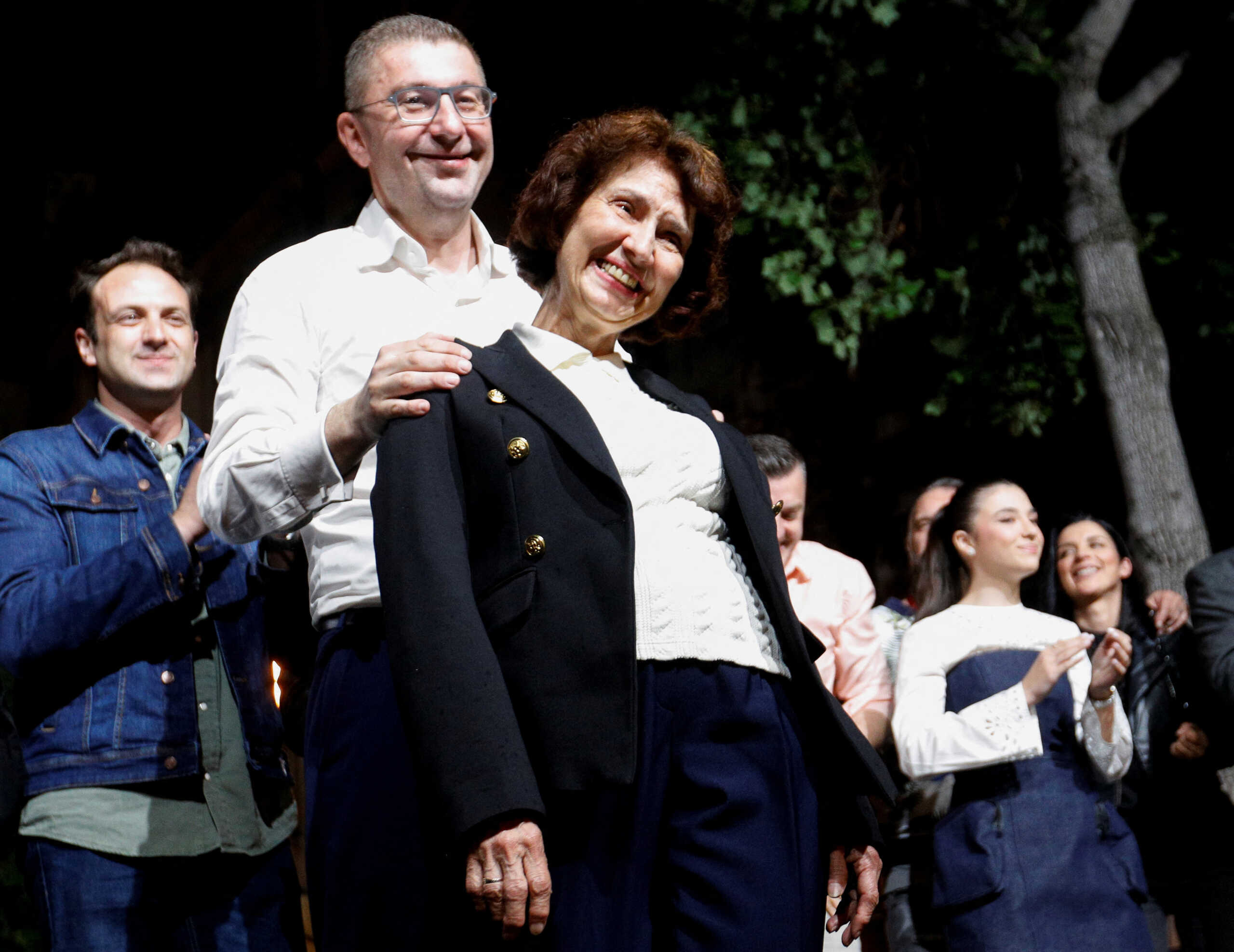 North Macedonian opposition party VMRO-DPMNE leader Hristijan Mickoski and presidential candidate Gordana Siljanovska-Davkova greet supporters following the parliamentary elections and second round of the presidential election in Skopje, North Macedonia, May 8, 2024. REUTERS