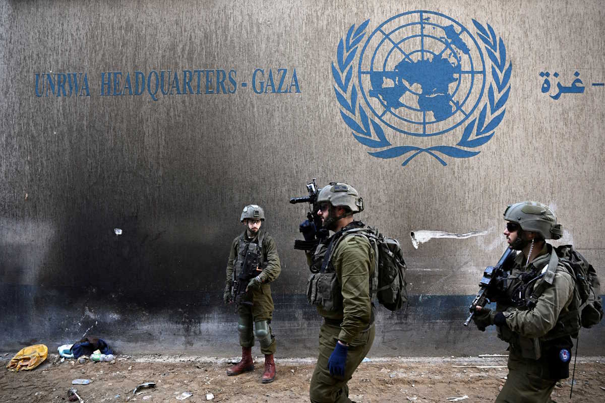 FILE PHOTO: Israeli soldiers operate next to the UNRWA headquarters, amid the ongoing conflict between Israel and the Palestinian Islamist group Hamas, in the Gaza Strip, February 8, 2024. REUTERS