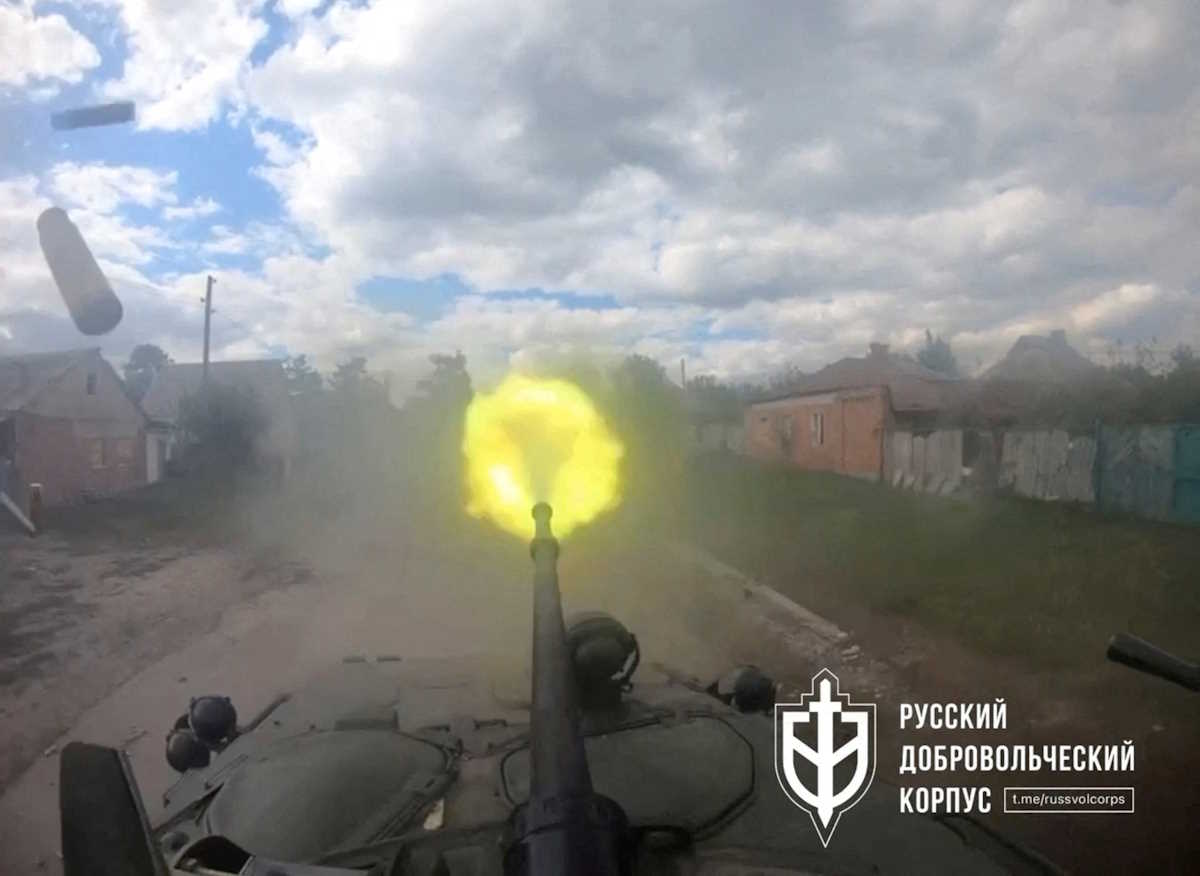 A weapon on an armoured vehicle with the Russian Volunteer Corps (RVC), a Ukrainian-backed paramilitary group that purports to be made up of Russians opposed to the Kremlin, is fired in Vovchansk, Kharkiv Oblast, Ukraine, in this still image obtained from video released May 13, 2024.    Russian Volunteer Corps