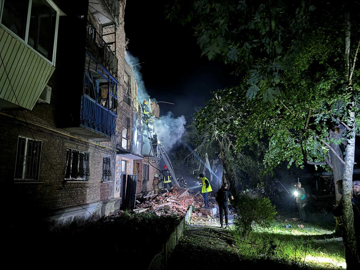 Firefighters work at a site of a residental building hit by a Russian missile strike, amid Russia's attack on Ukraine, in Kharkiv, Ukraine May 31, 2024. REUTERS