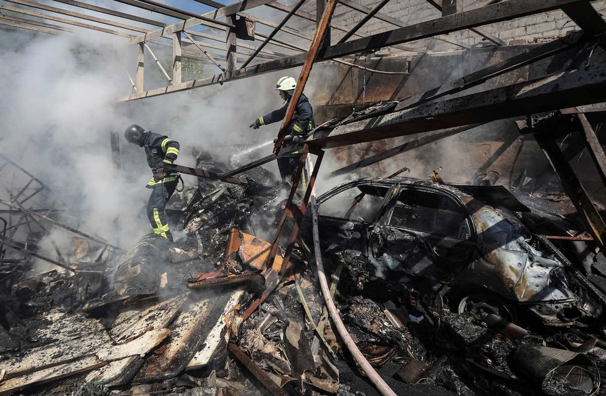 Rescuers work at a site of a Russian missile strike, amid Russia's attack on Ukraine, in Kharkiv, Ukraine April 30, 2024. REUTERS